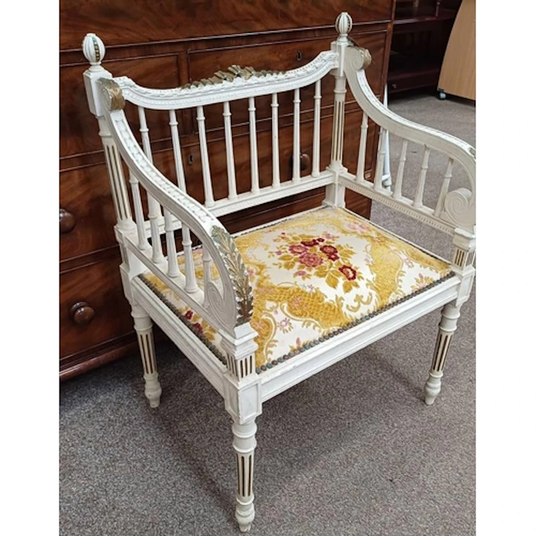 LATE 19TH CENTURY CARVED WHITE & GILT SCROLL ARMCHAIR ON REE...