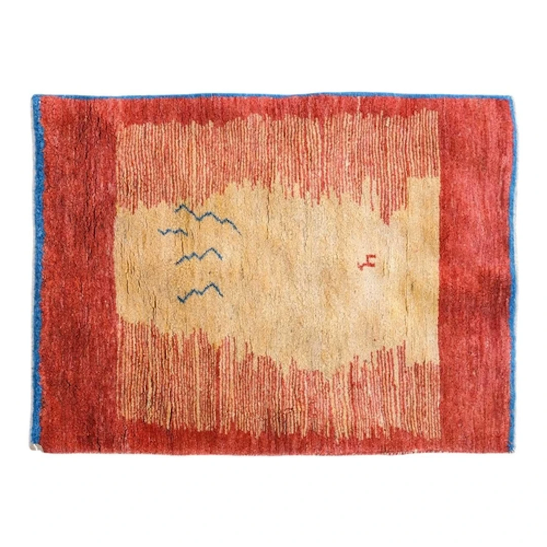 A Gabbeh rug. 100% wool pile, depicting a sunset with a cent...