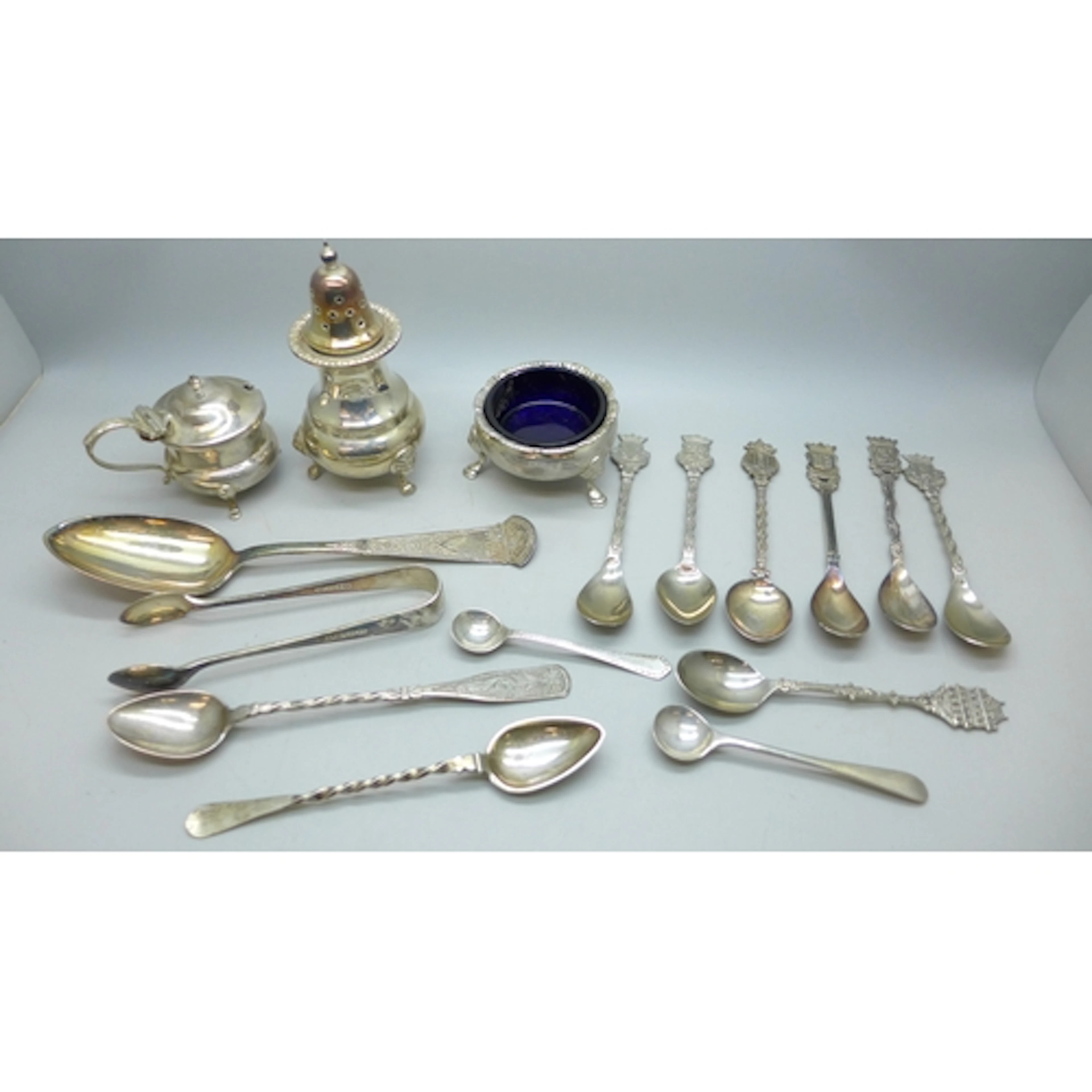 Three unmatched silver condiments, 193g without glass liners...
