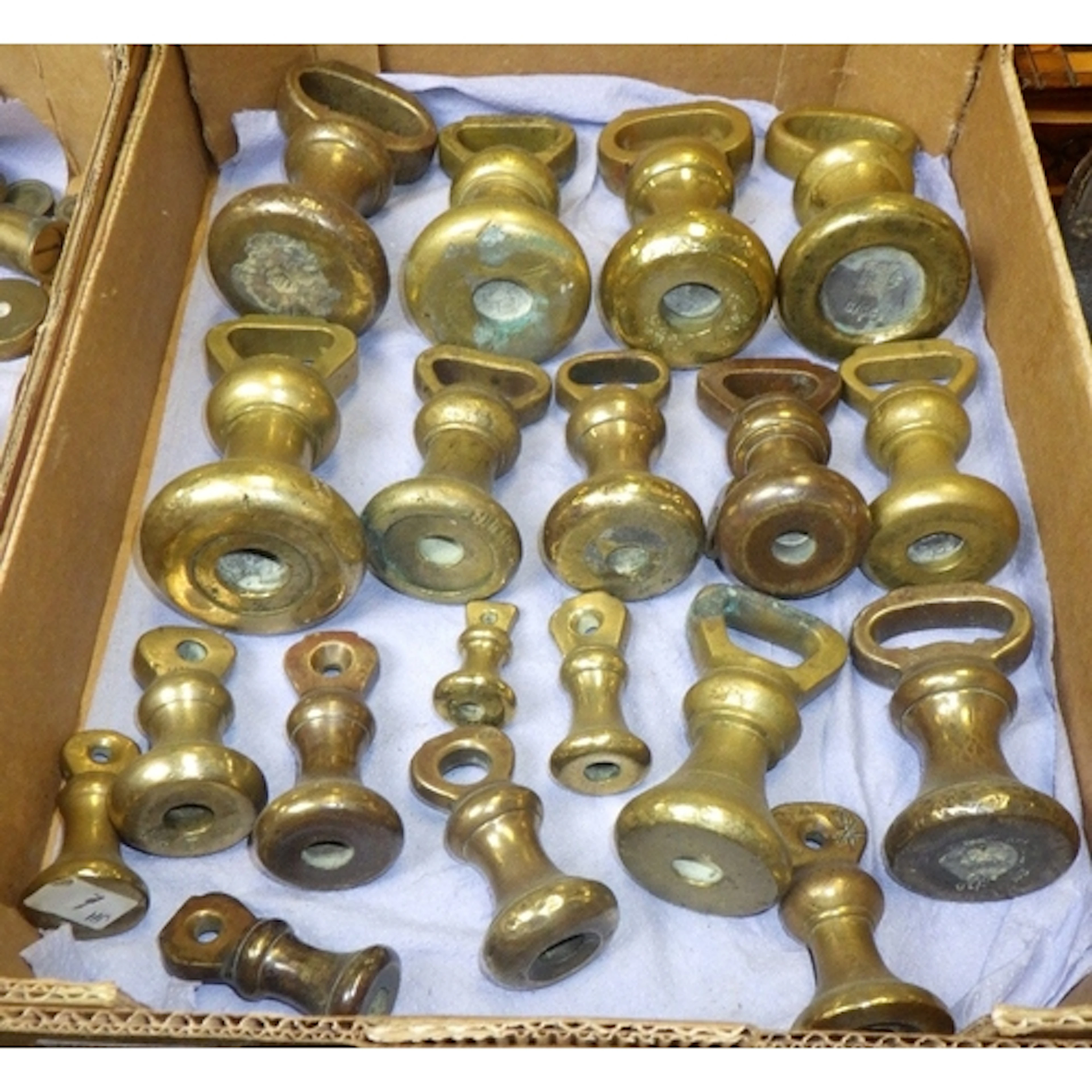 A group of brass bell weights