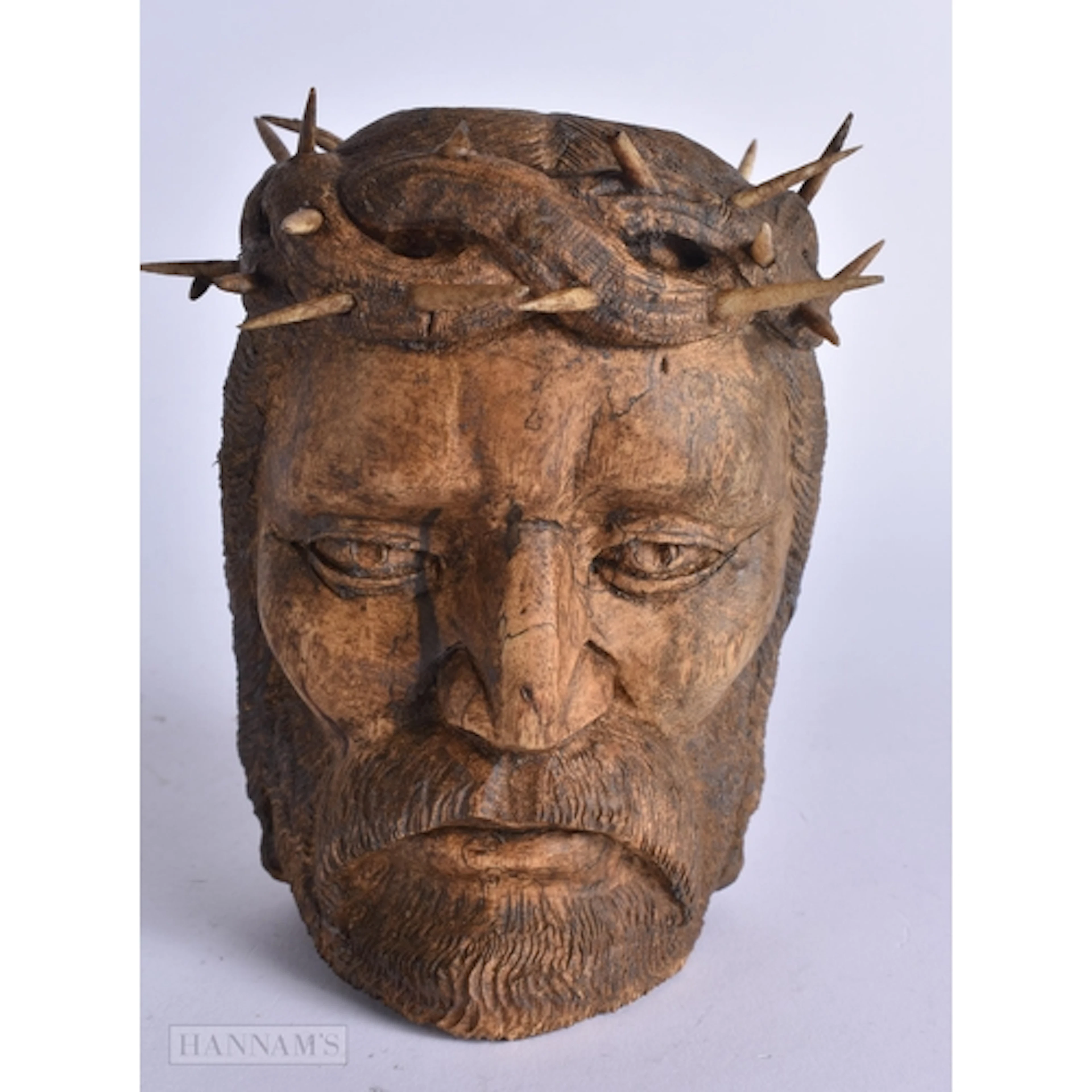 A CARVED WOOD BUST OF CHRIST. 15 cm x 10 cm.