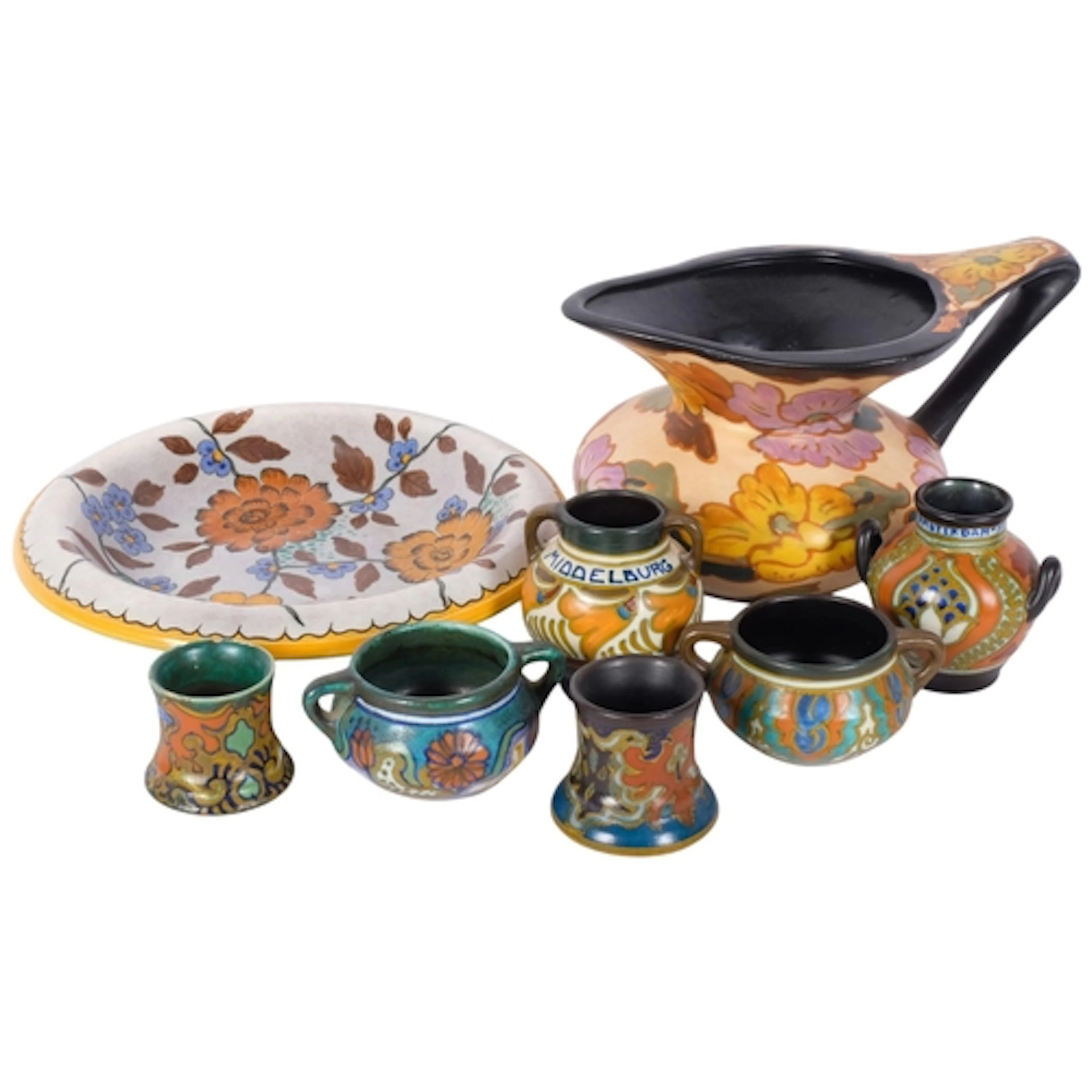 A group of Gouda pottery vases, jug, and a dish with floral ...