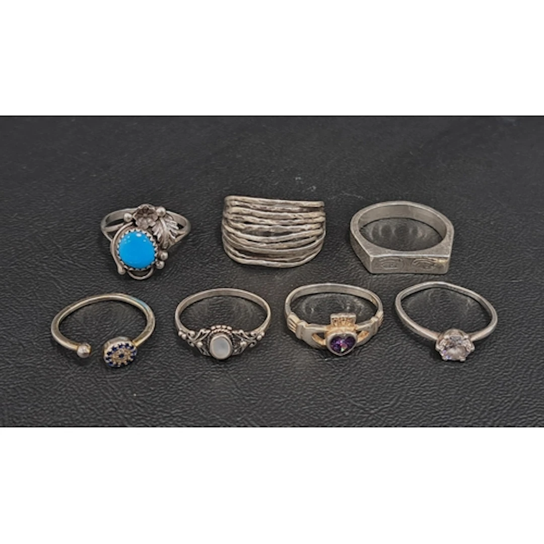 SEVEN SILVER RINGS including turquoise, mother of pearl and ...