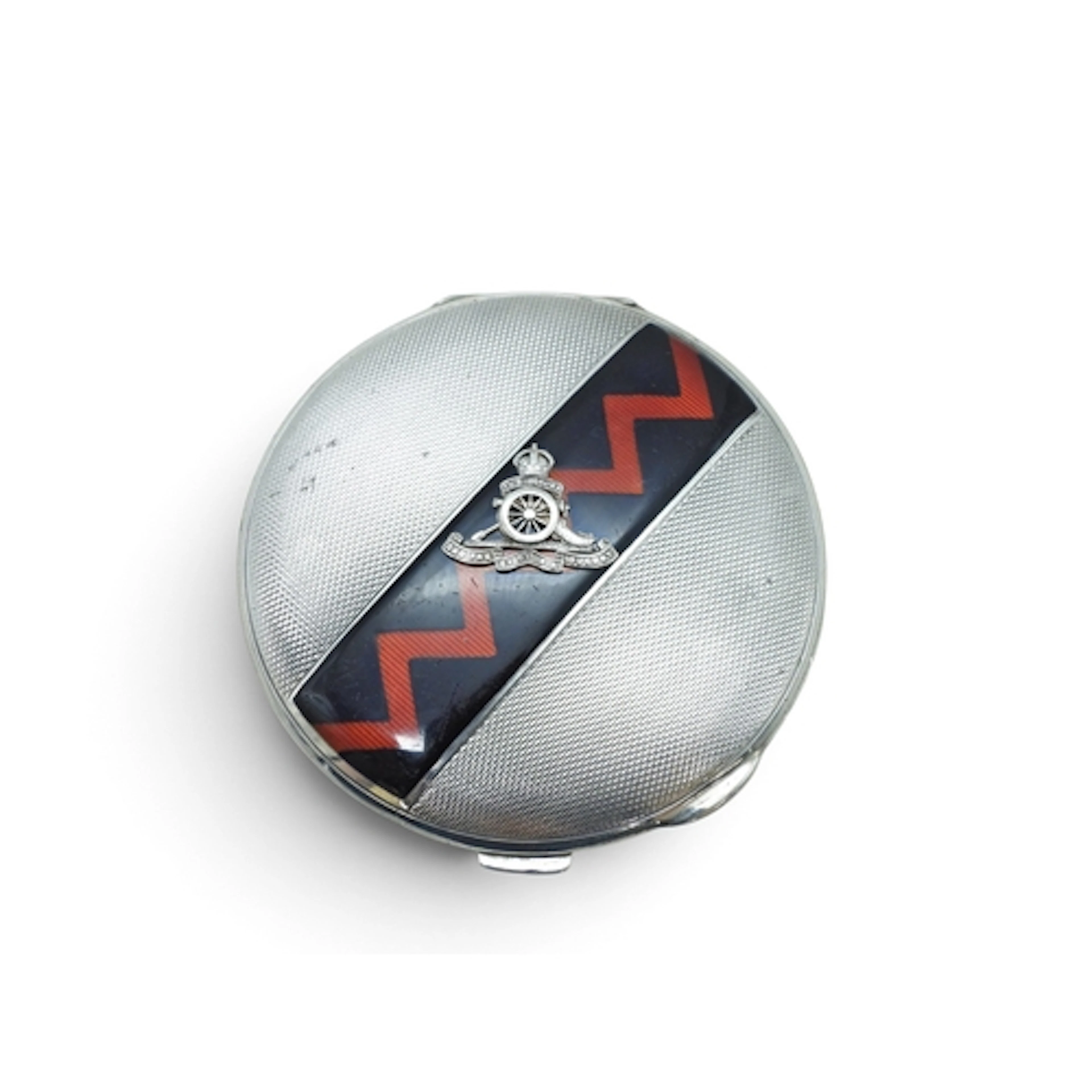 A silver powder compact, bearing the insignia for The Royal ...