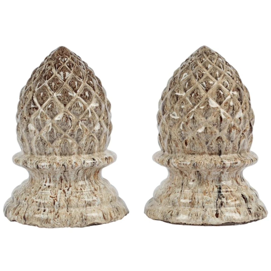 A pair of marbled majolica pineapple finials, early 20th ce...