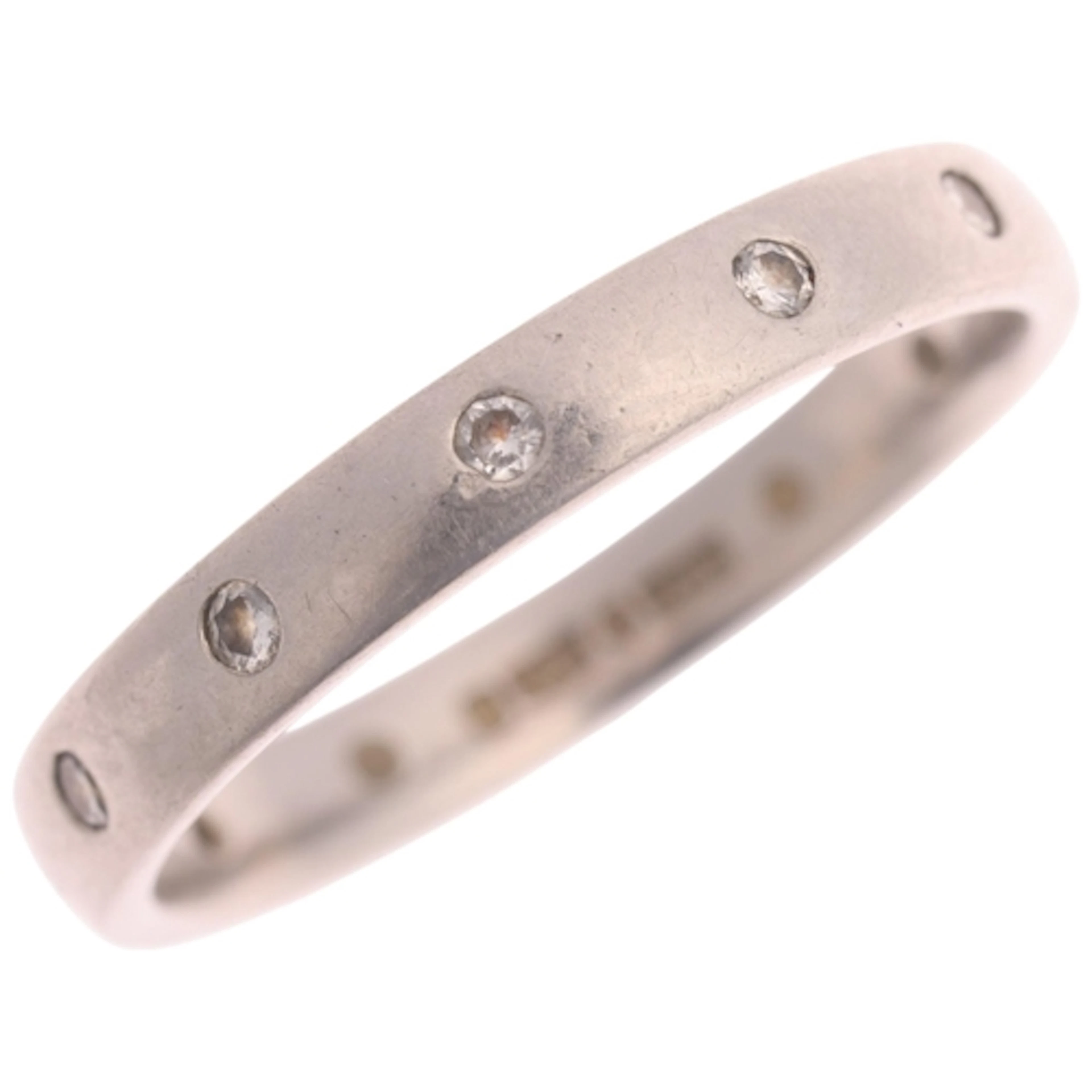 A platinum diamond full eternity ring, maker B & N, rub-over...
