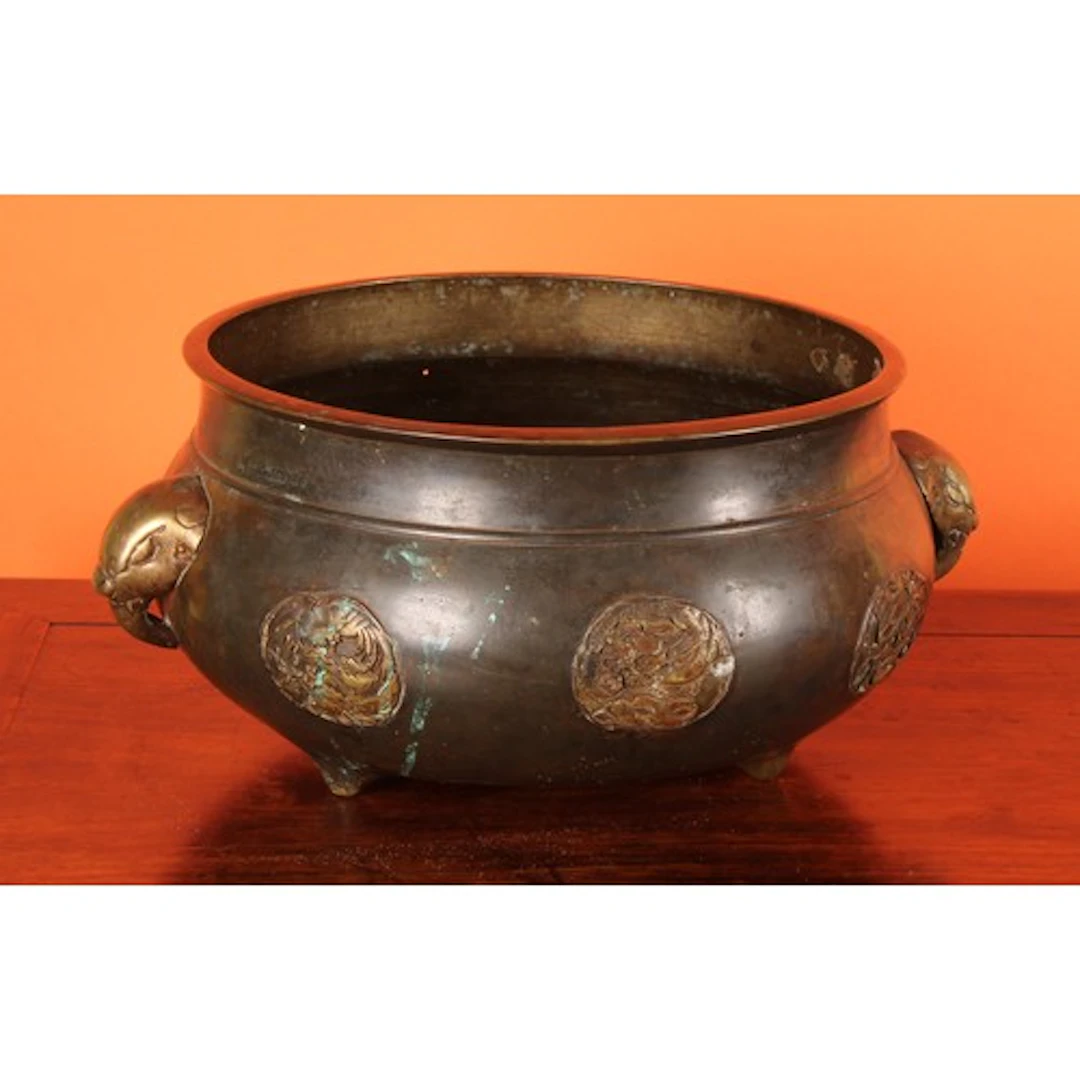 A Chinese brown patinated bronze, senser, elephant mask hand...