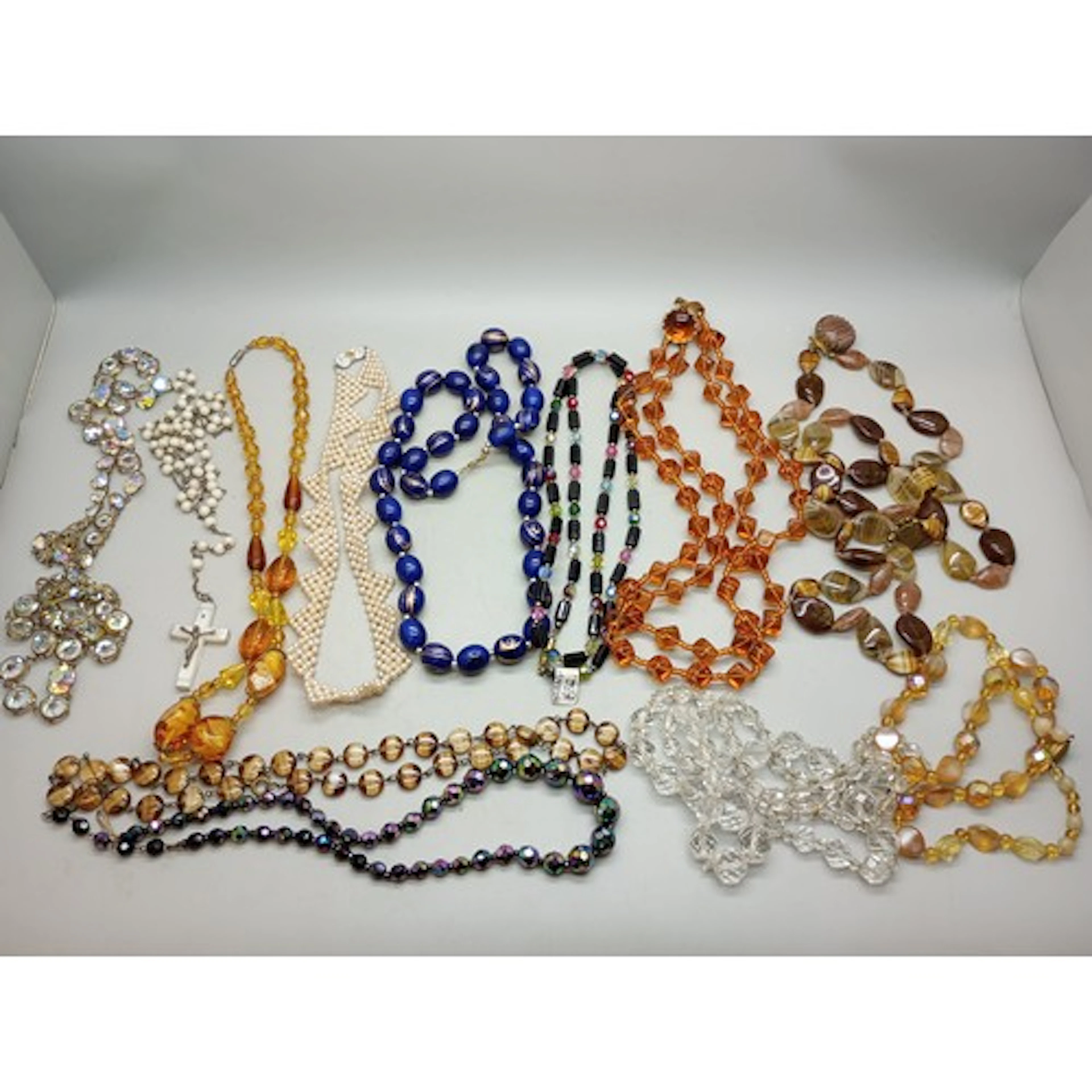 A collection of costume necklaces including vintage