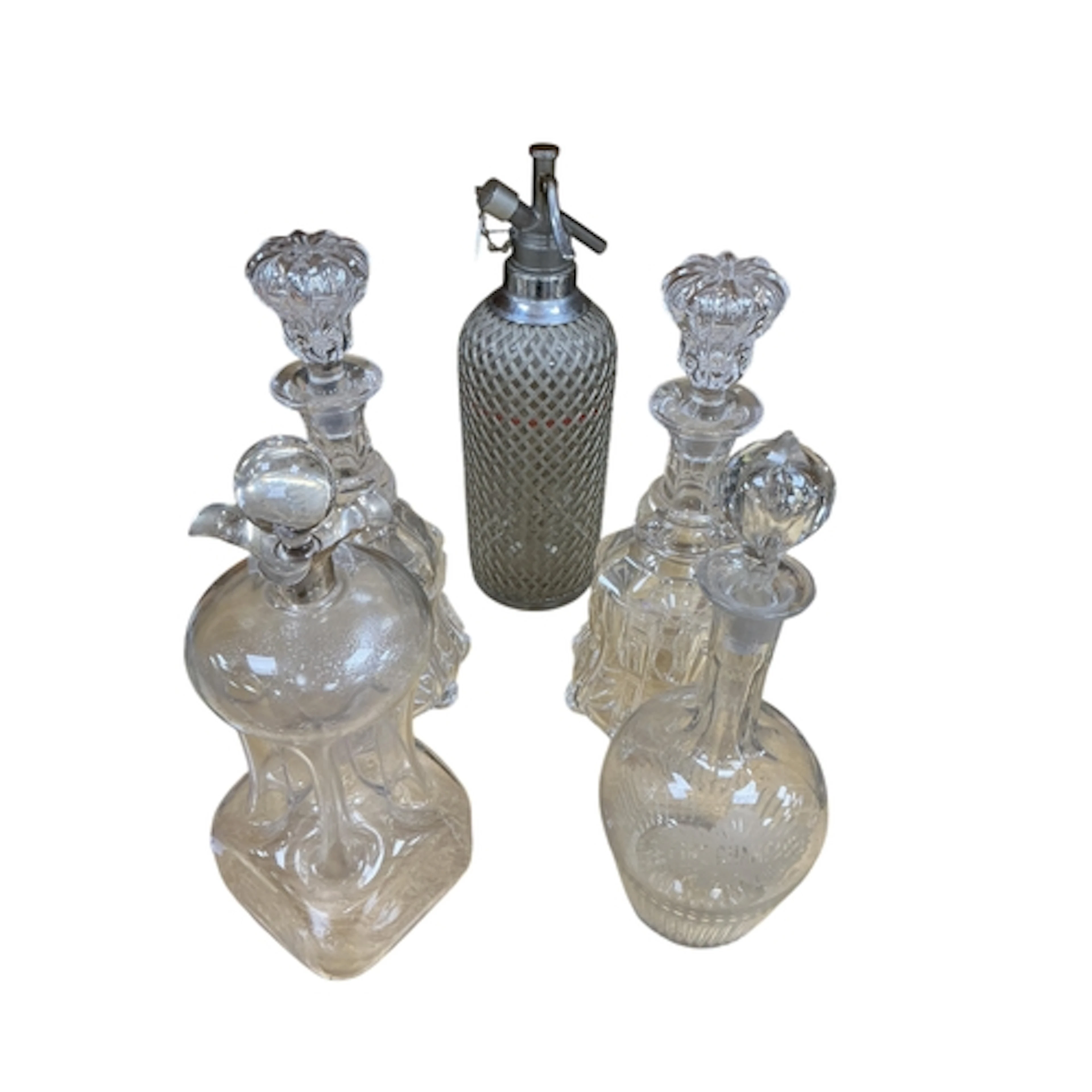 An early 20th century silver mounted decanter, three others ...