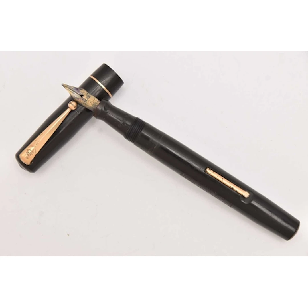 A 'SWAN' FOUNTAIN PEN, black a yellow metal pen signed 'Swan...