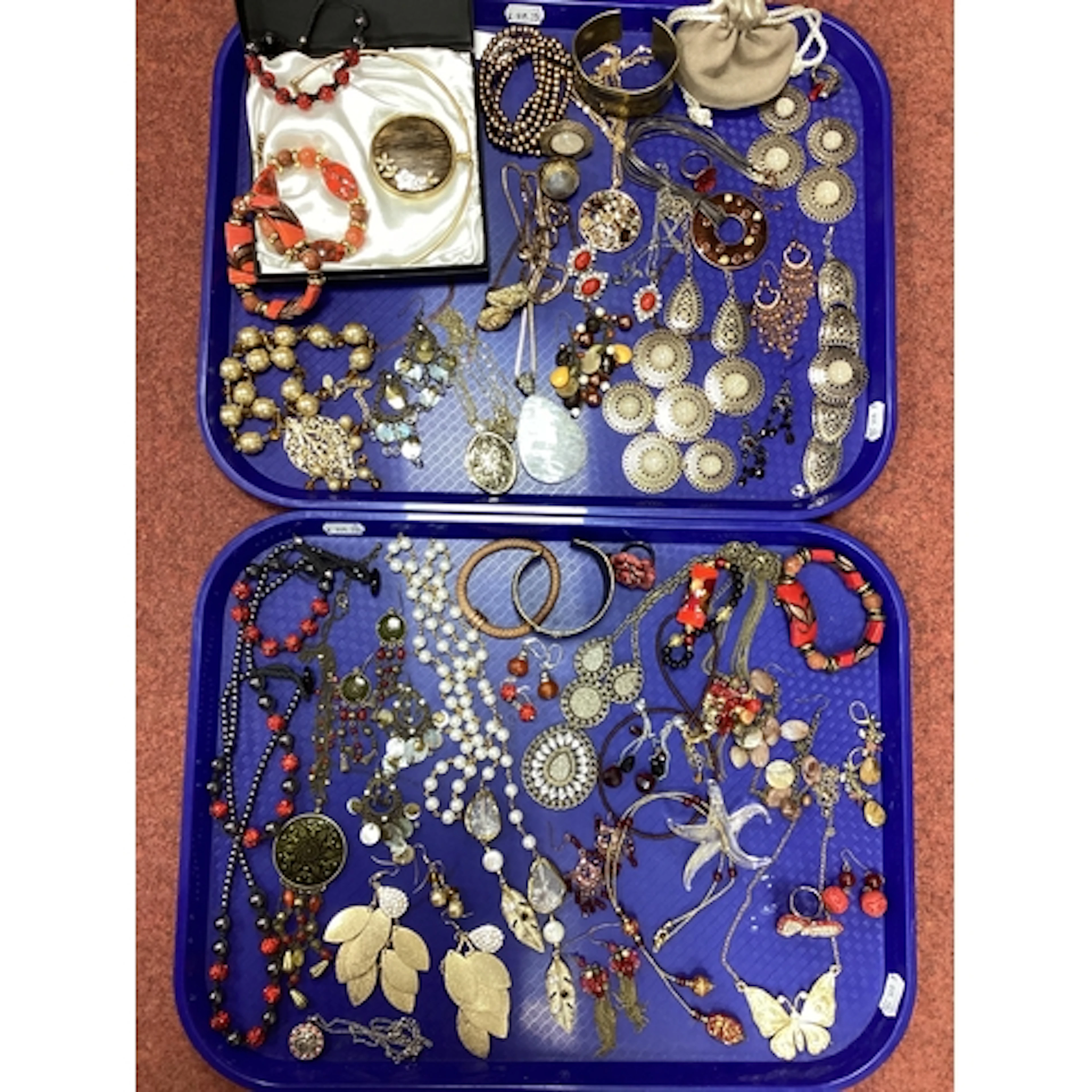 A Collection of Assorted Costume Jewellery, in hues of red a...
