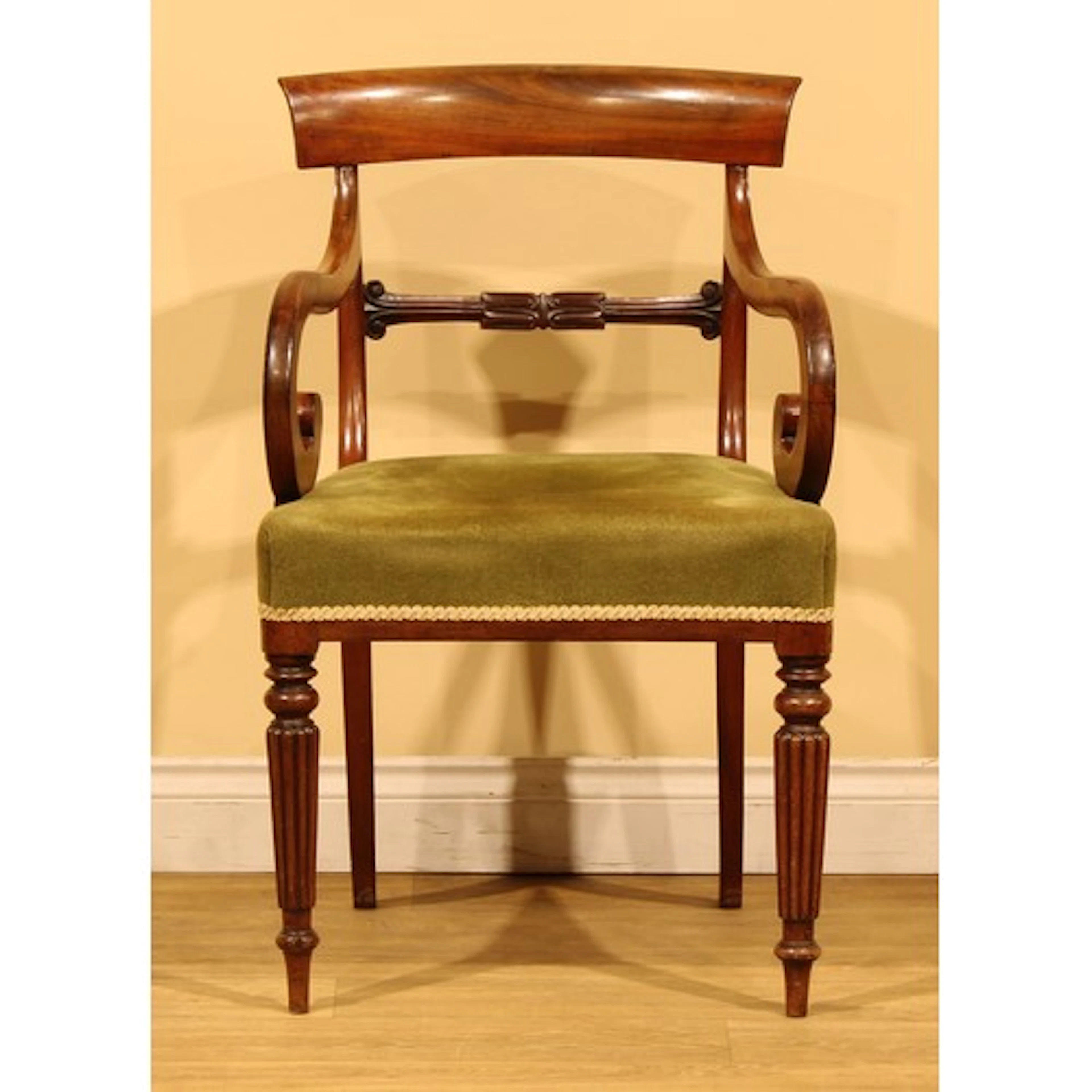 A George IV mahogany elbow or desk chair, organic mid-rail, ...