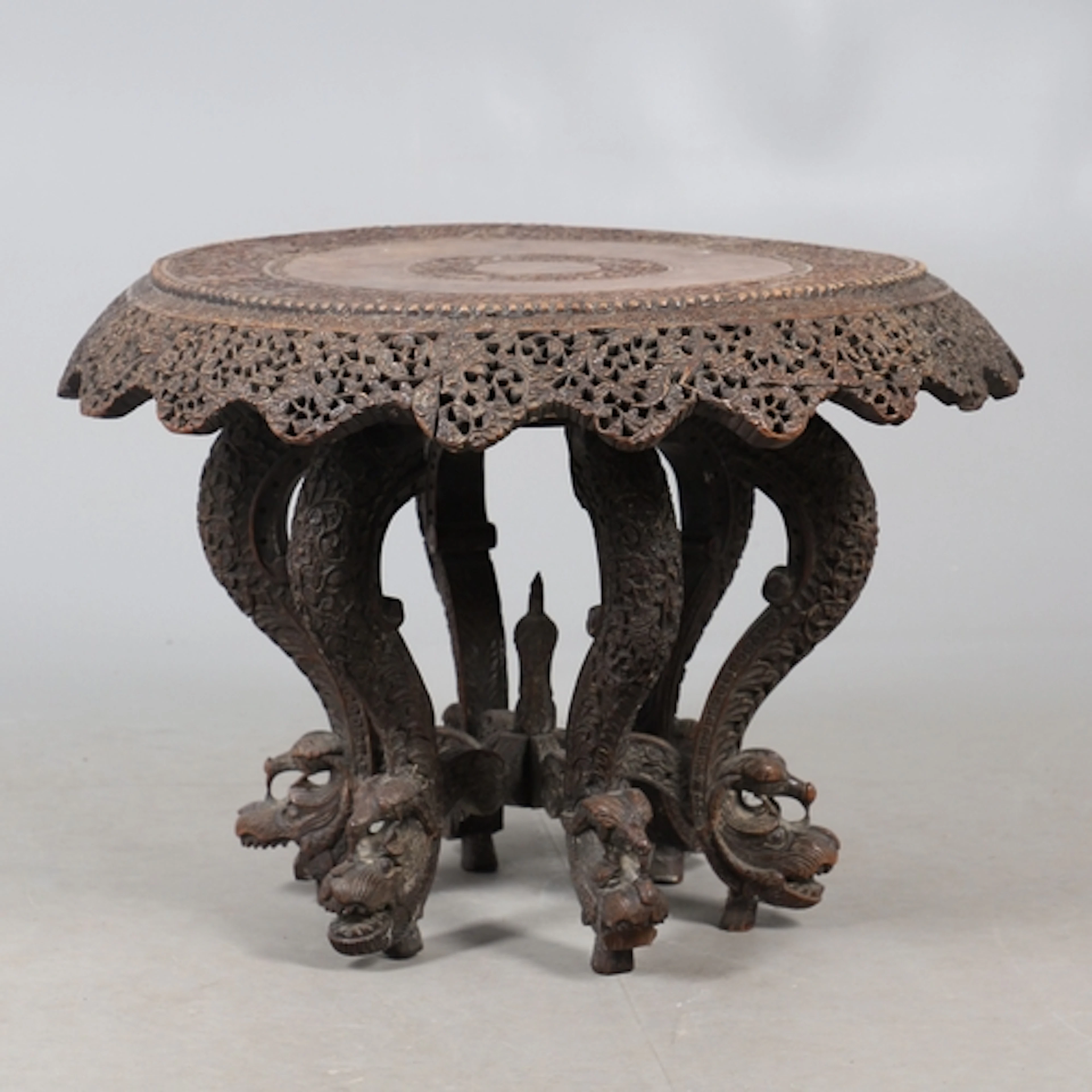 A 19TH CENTURY BURMESE HARDWOOD TIFFIN TABLE. the lazy Susan...
