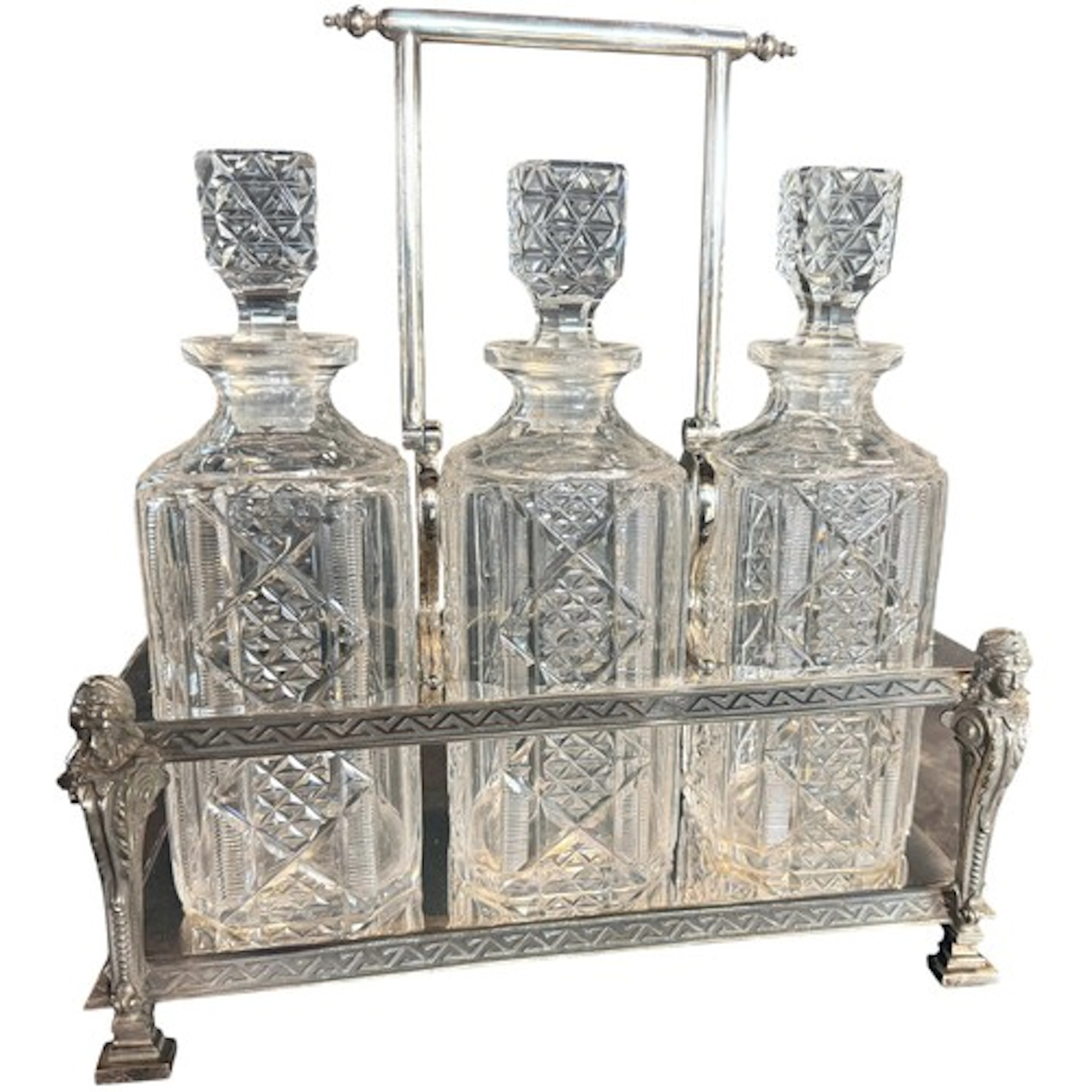 An Empire Revival silver plated three sectional decanter sta...