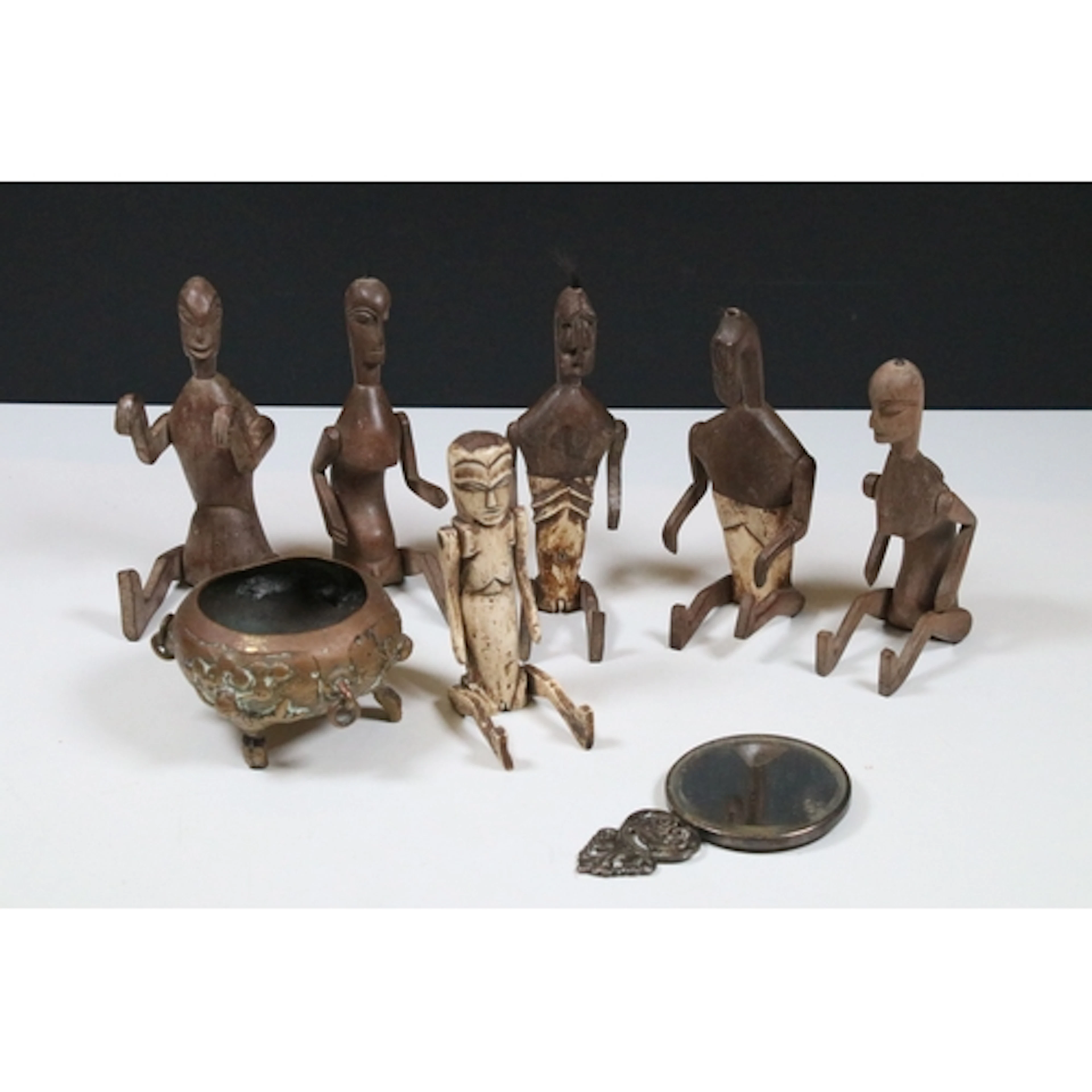 Collection of carved articulated figures, some with bone tor...