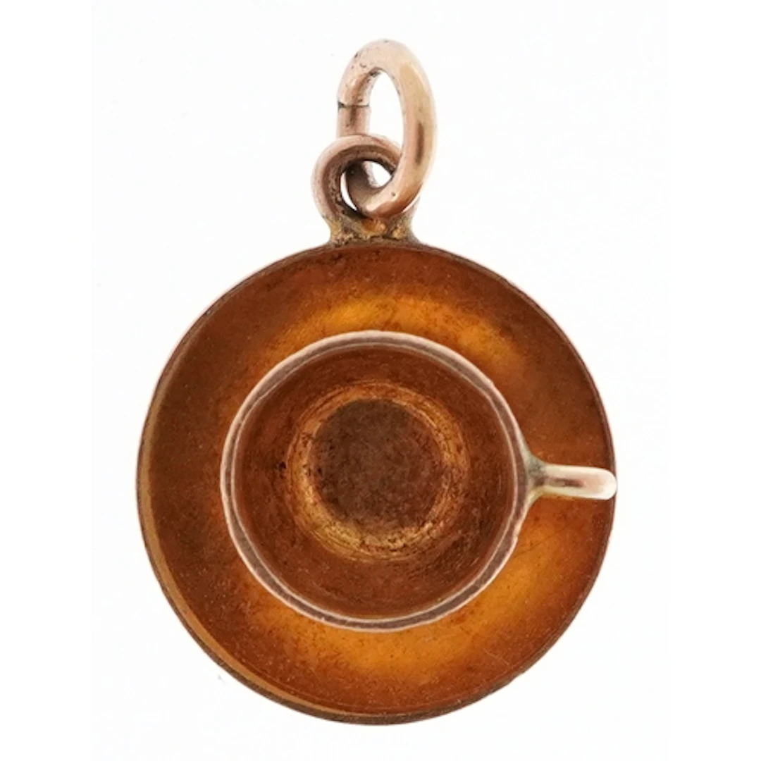 9ct gold charm in the form of a cup on a saucer, 10.0mm in d...