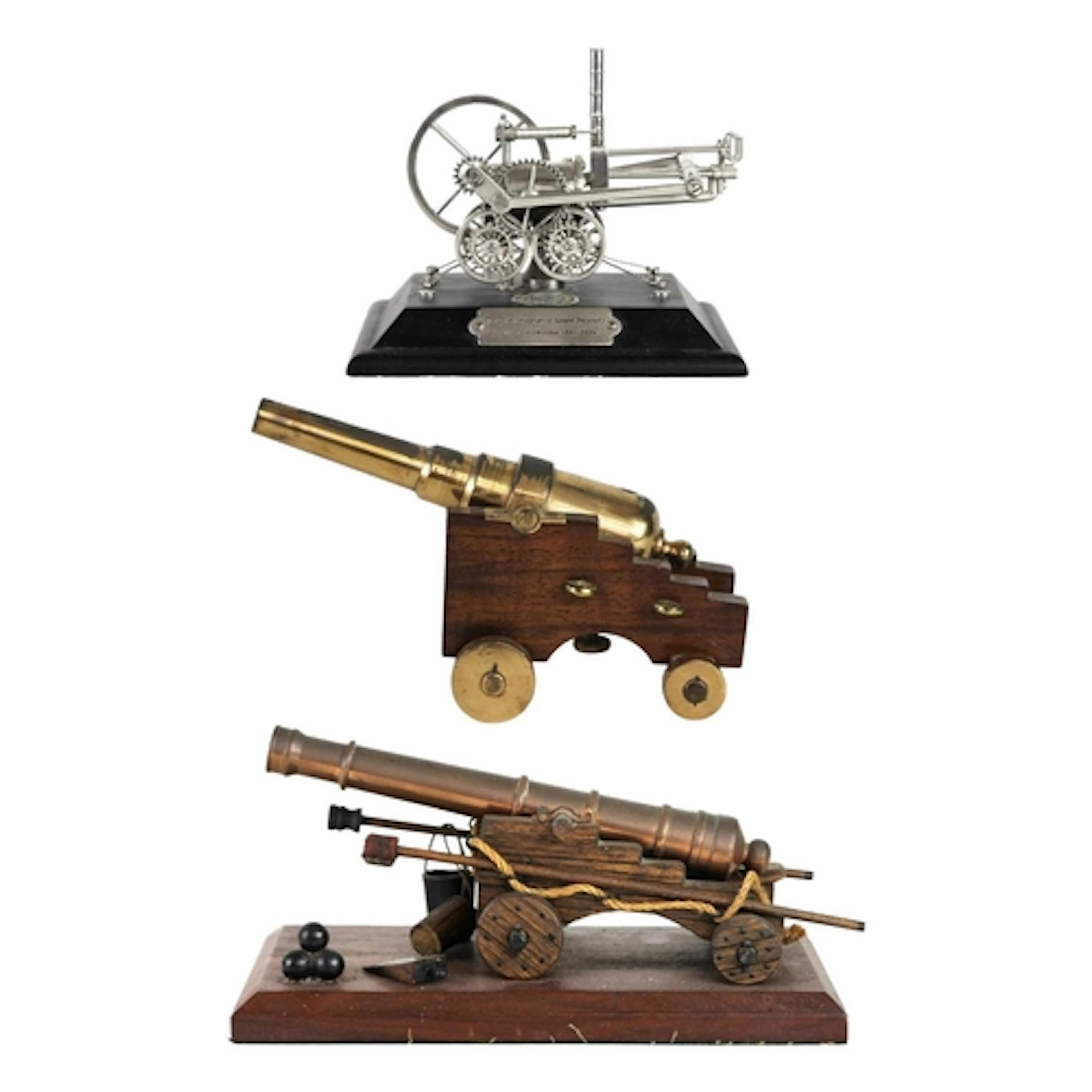 A bronze model cannon. Raised on an oak carriage with a maho...