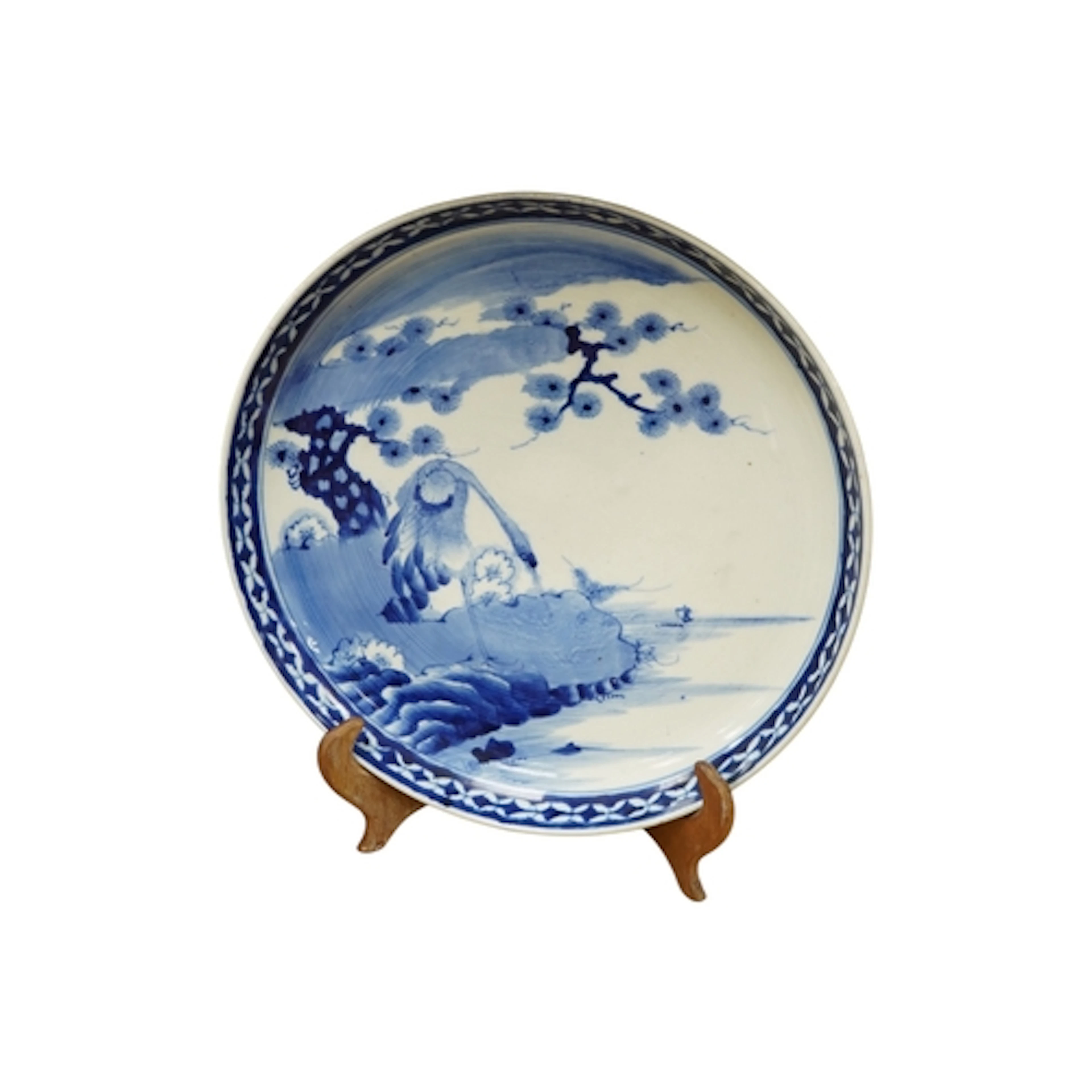 A Chinese blue and white porcelain charger decorated with a ...