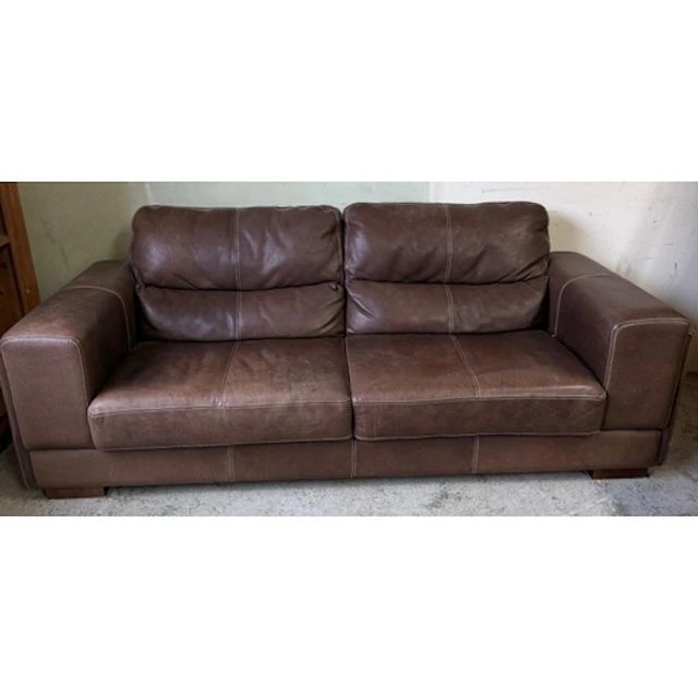 A brown leather three seater sofa on block feet. Back height...