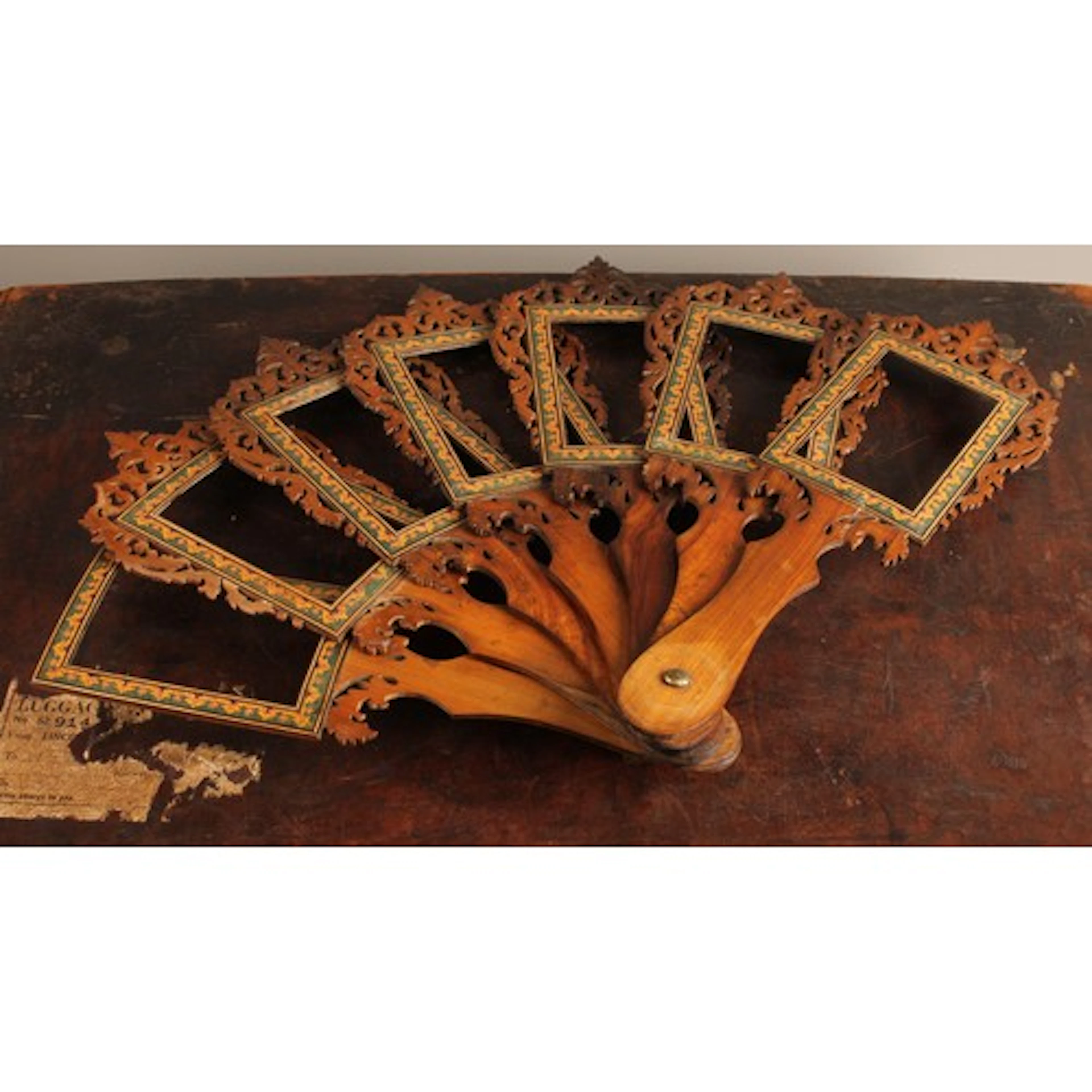 A set of seven 19th century walnut photograph frames, joined...