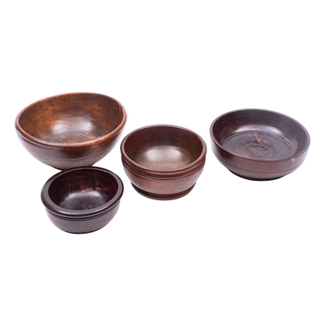 Four turned treen bowls, 19th century; comprising a fruitwoo...