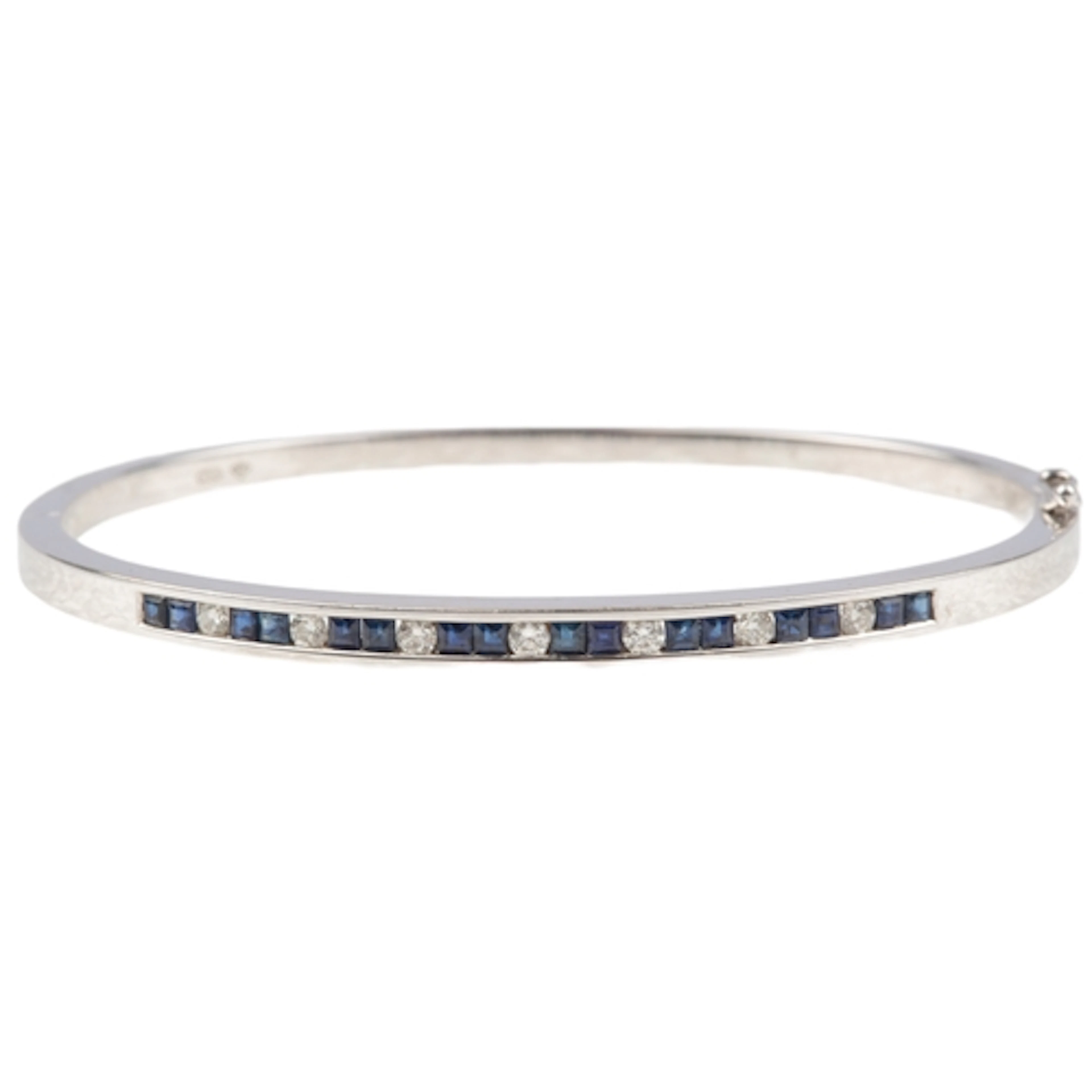 A sapphire and diamond bangle, of hinged construction, the f...