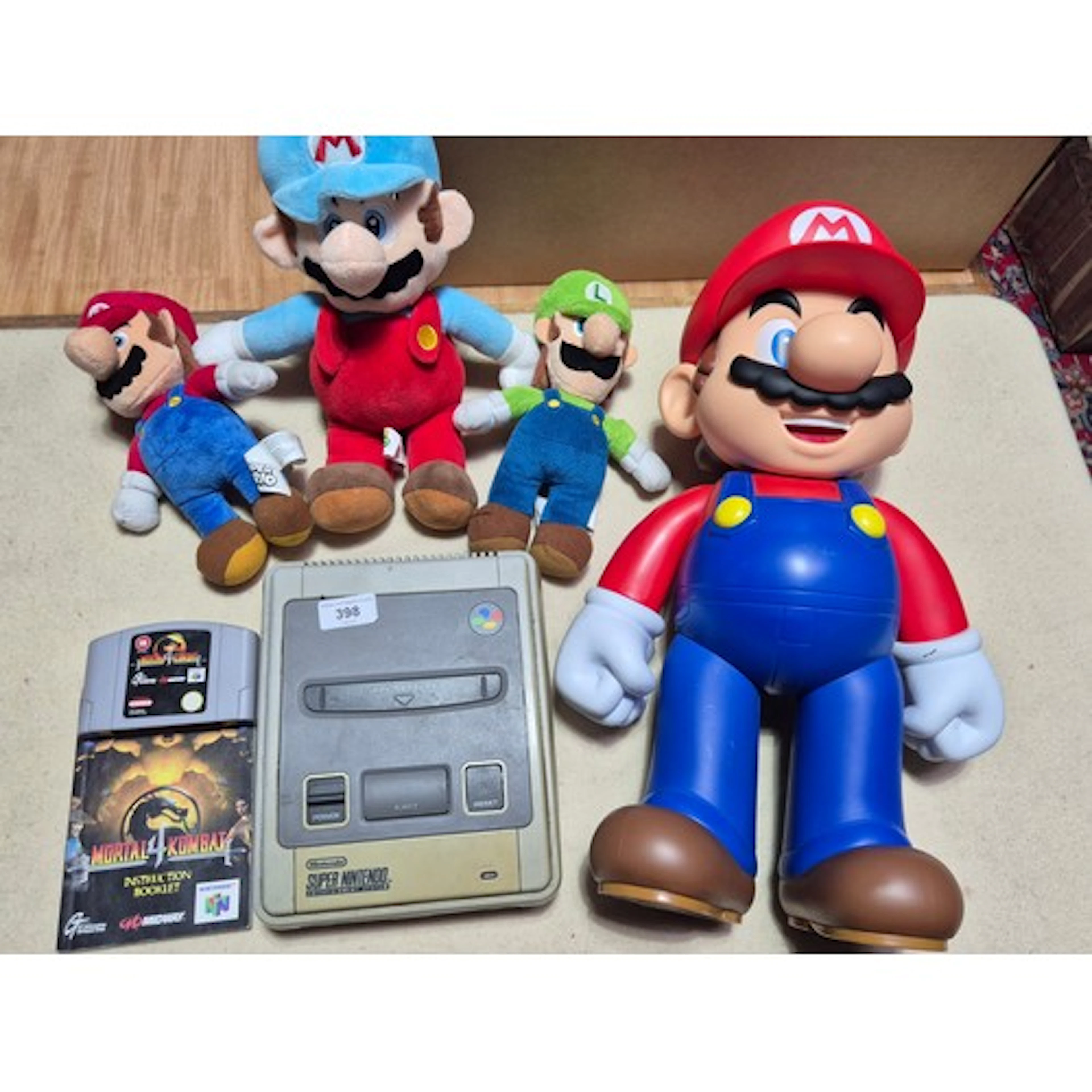A Super Nintendo Entertainment System, a Mortal Kombat N64 g...