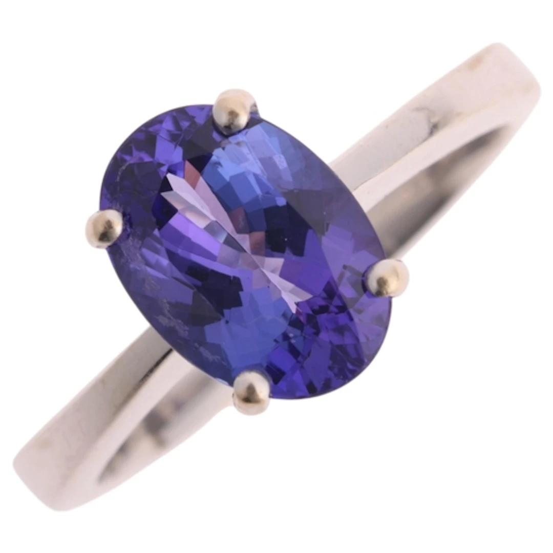 An 18ct white gold single stone tanzanite ring, claw set wit...