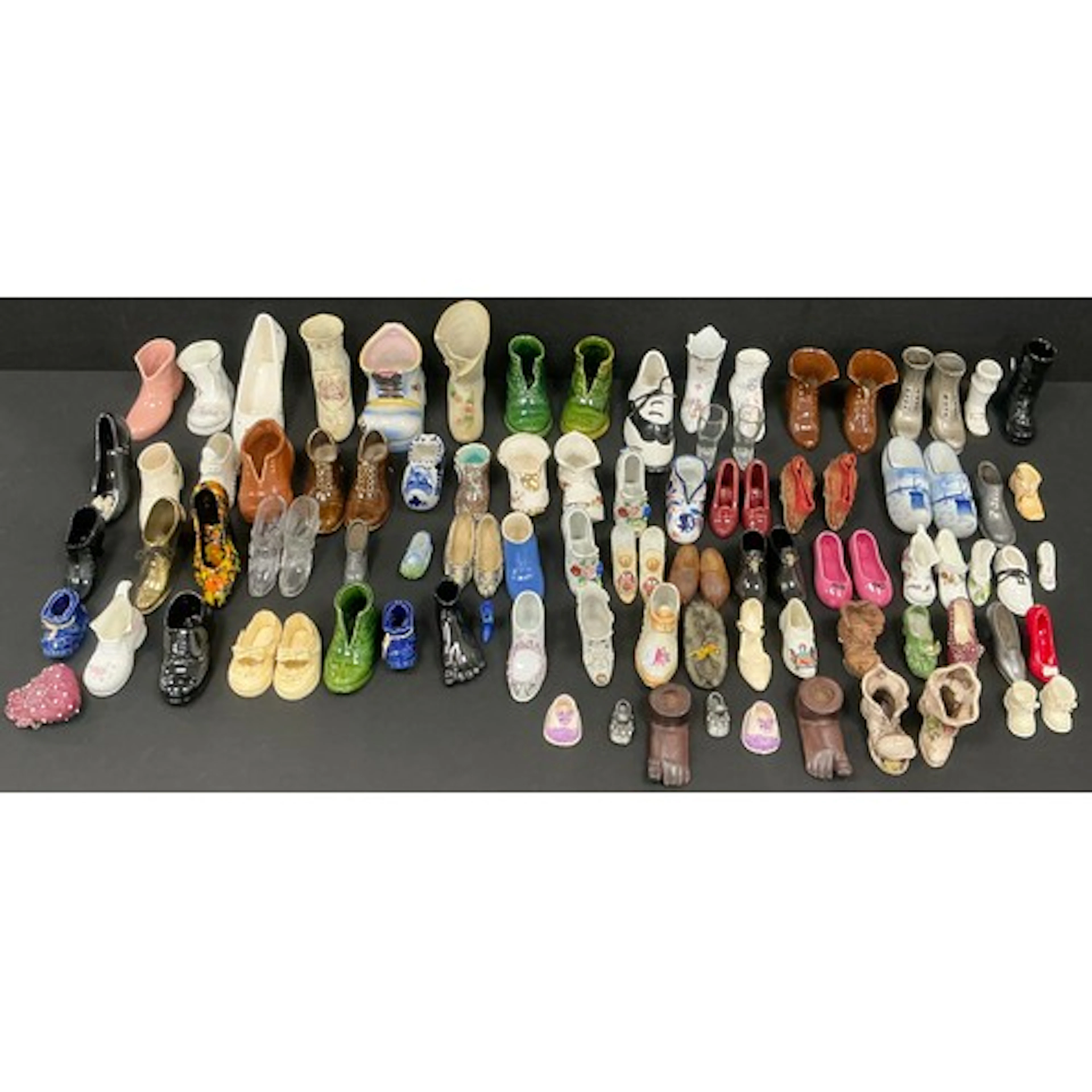 A large collection of ceramic miniature posy shoes, to inclu...