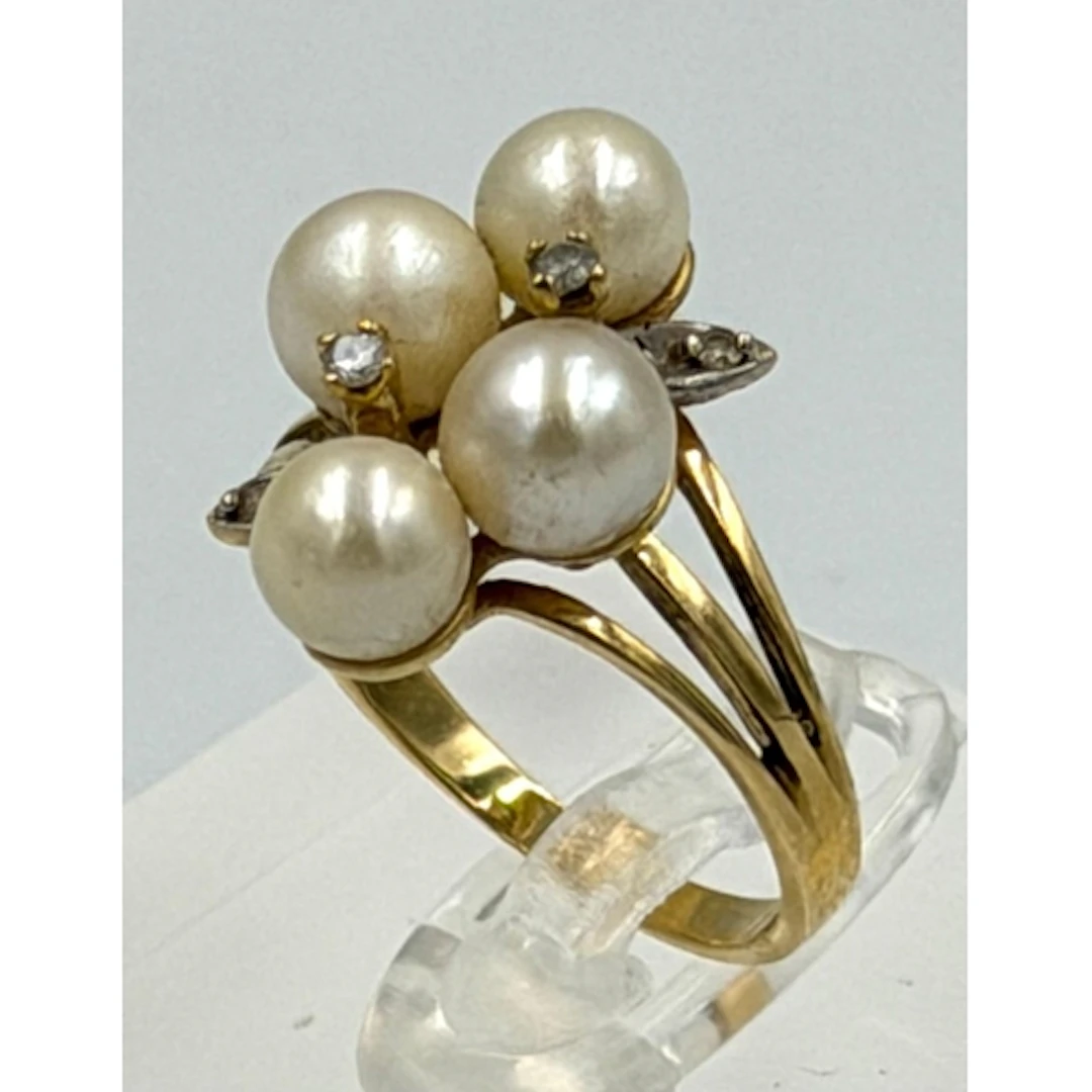 A 14ct yellow gold four pearl and diamond ring, approximate ...