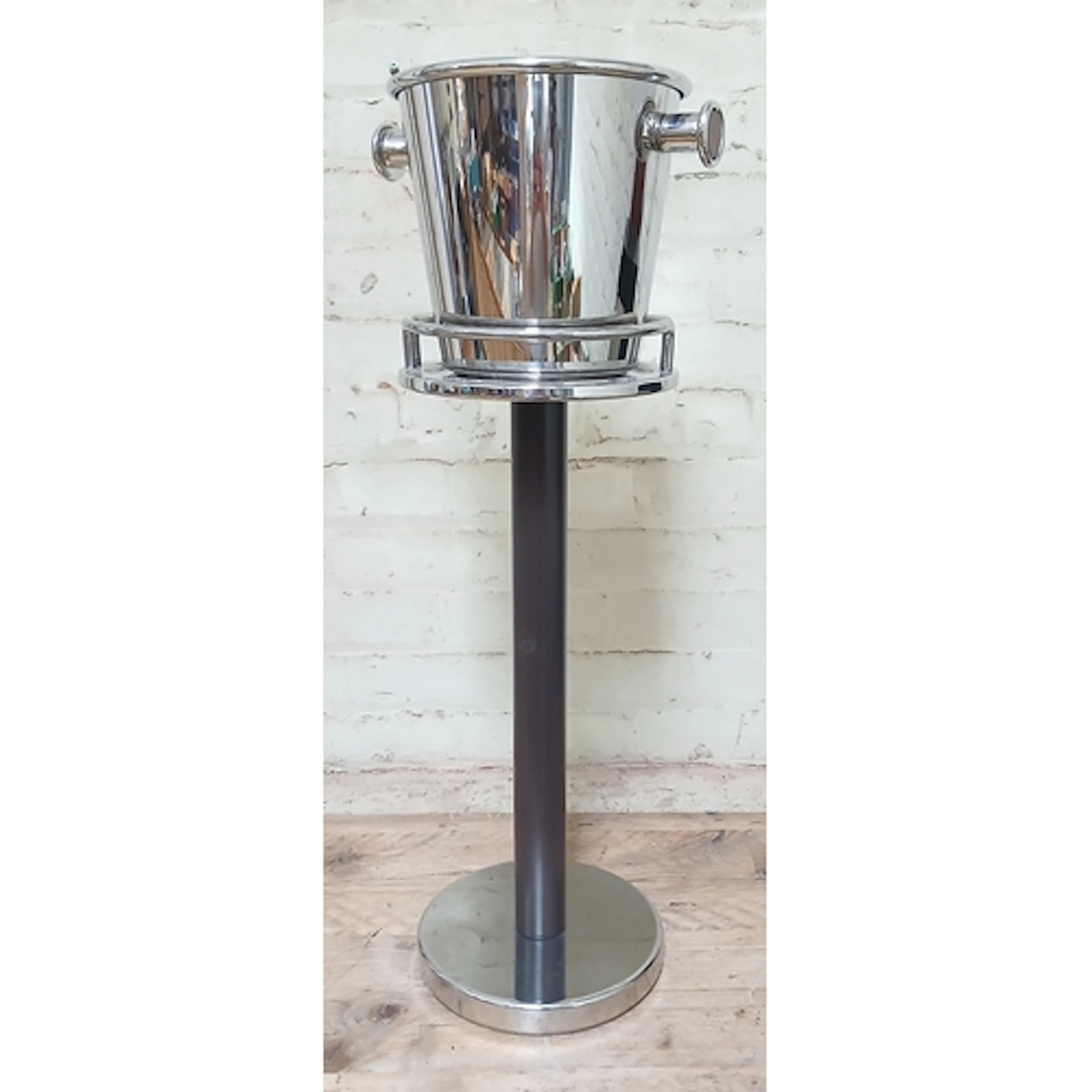 Alessi, a stainless steel wine cooler and stand, designed by...