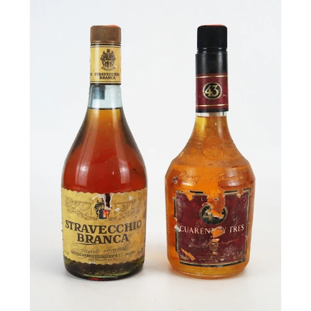Stravecchio Branca brandy 70 cl and a bottle of Cuarently Tr...