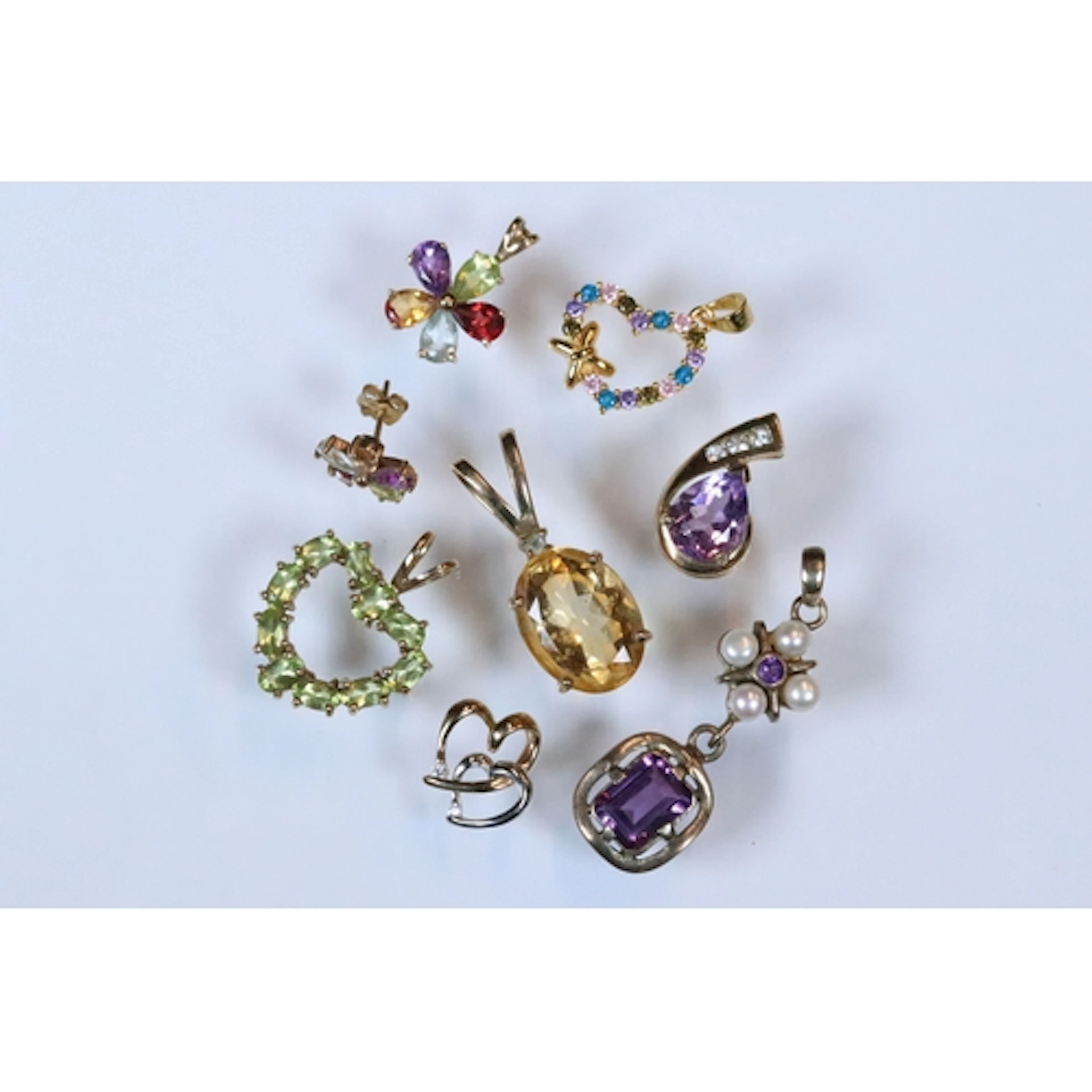 Collection of pendants to include a 9ct gold and citrine pen...