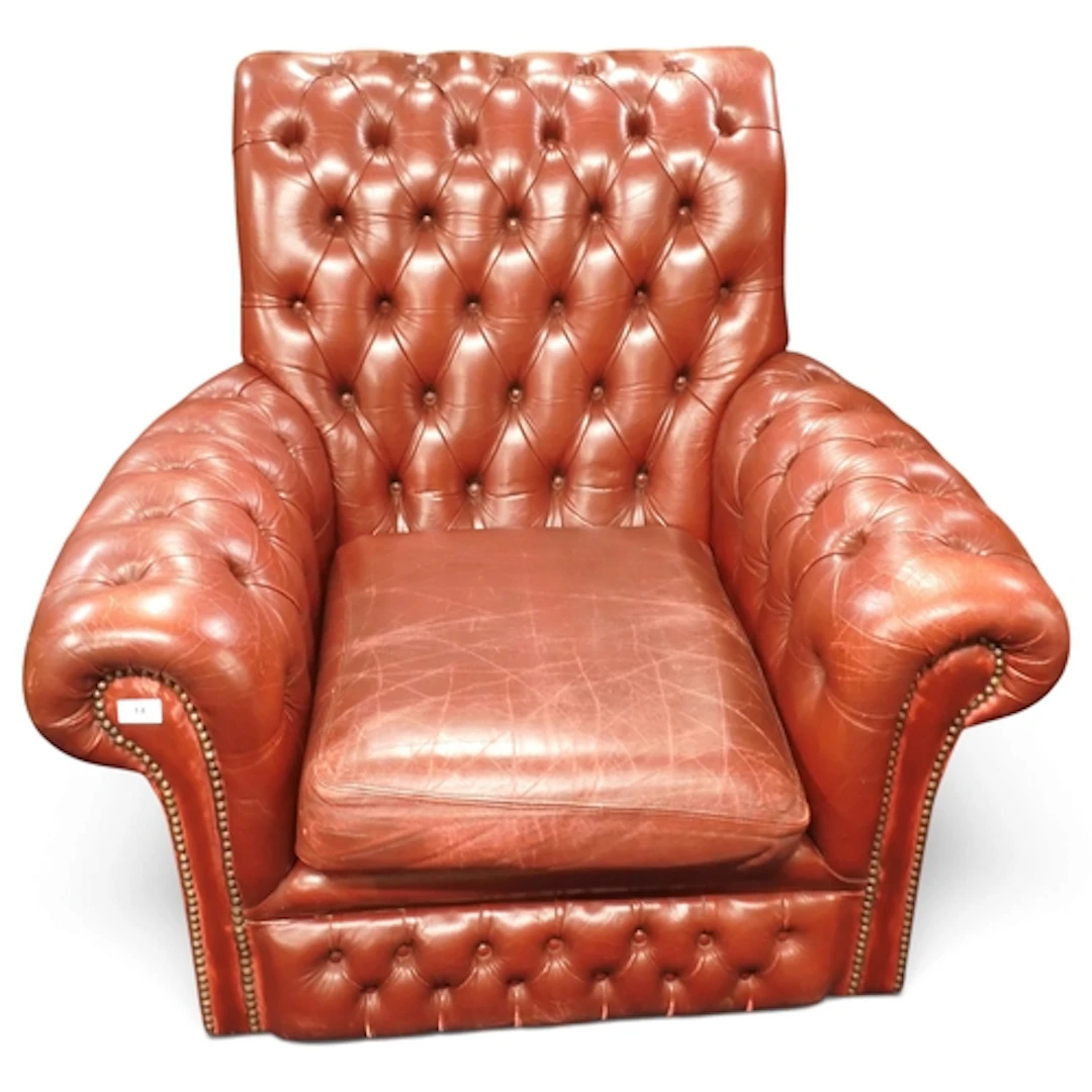 A 20th century oxblood leather button back upholstered Chest...