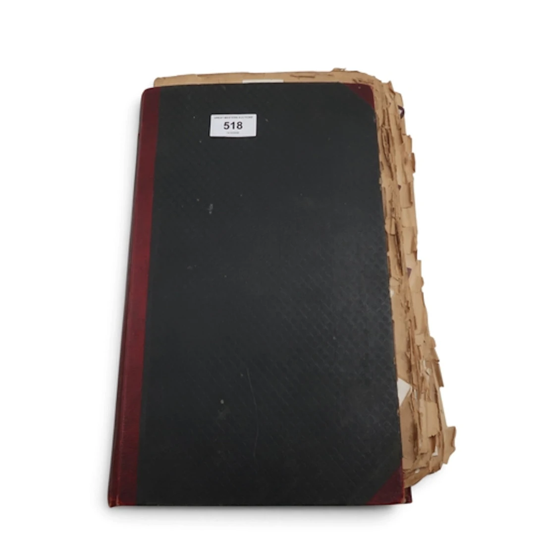 An early-20th century scrapbook, containing a variety of cig...