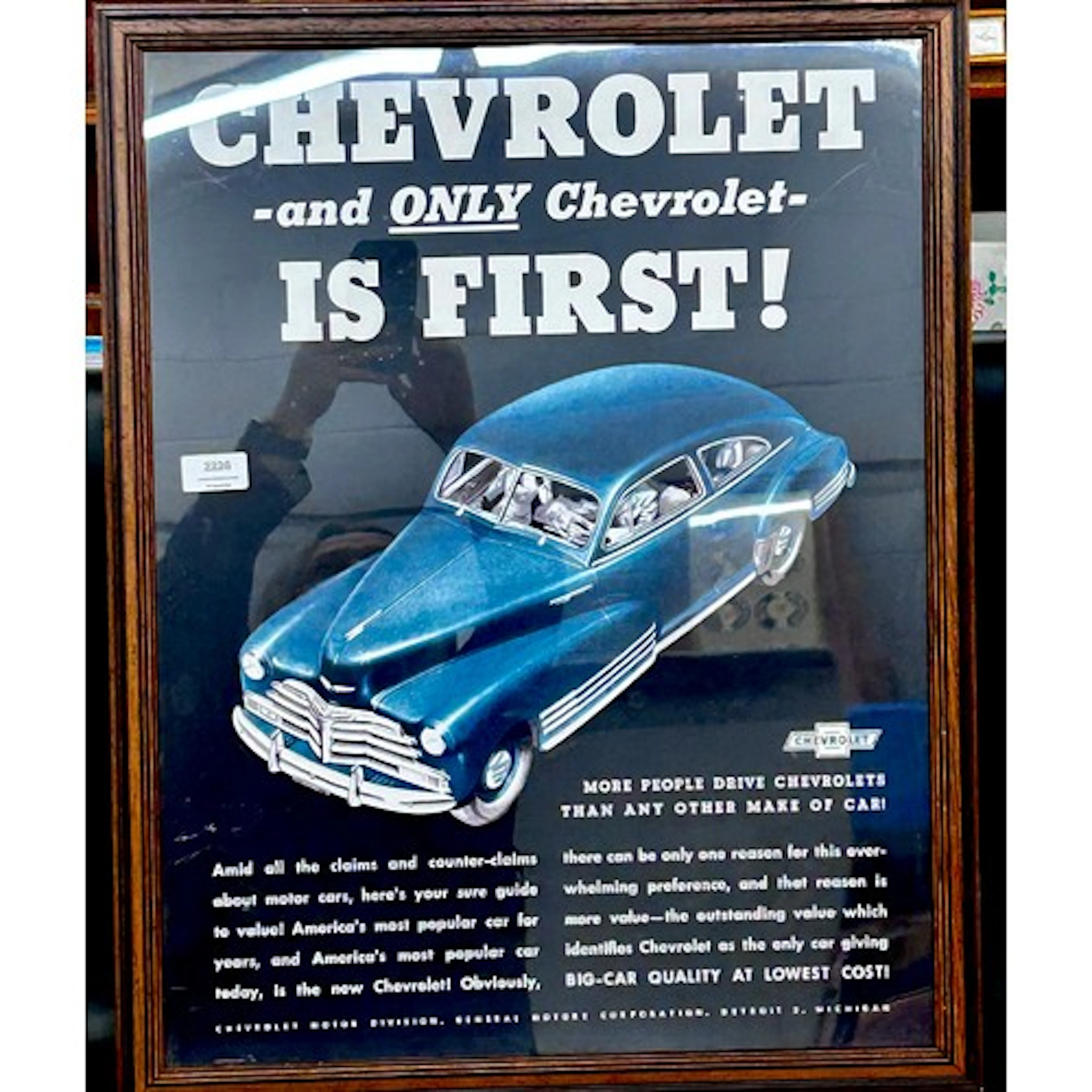A Chevrolet motor car framed poster, 65cm x 51cm