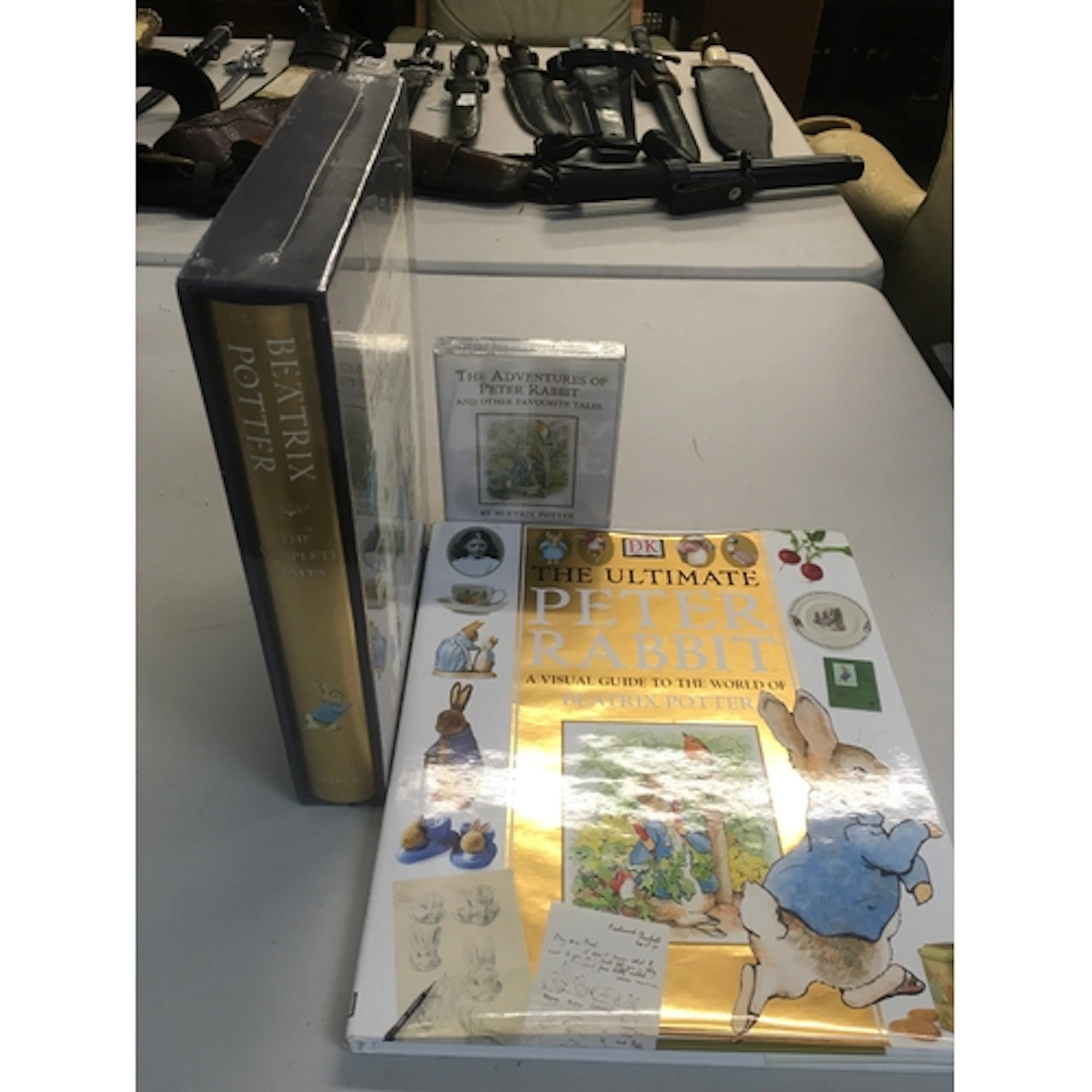 A collection of Beatrix Potter items including a visual guid...