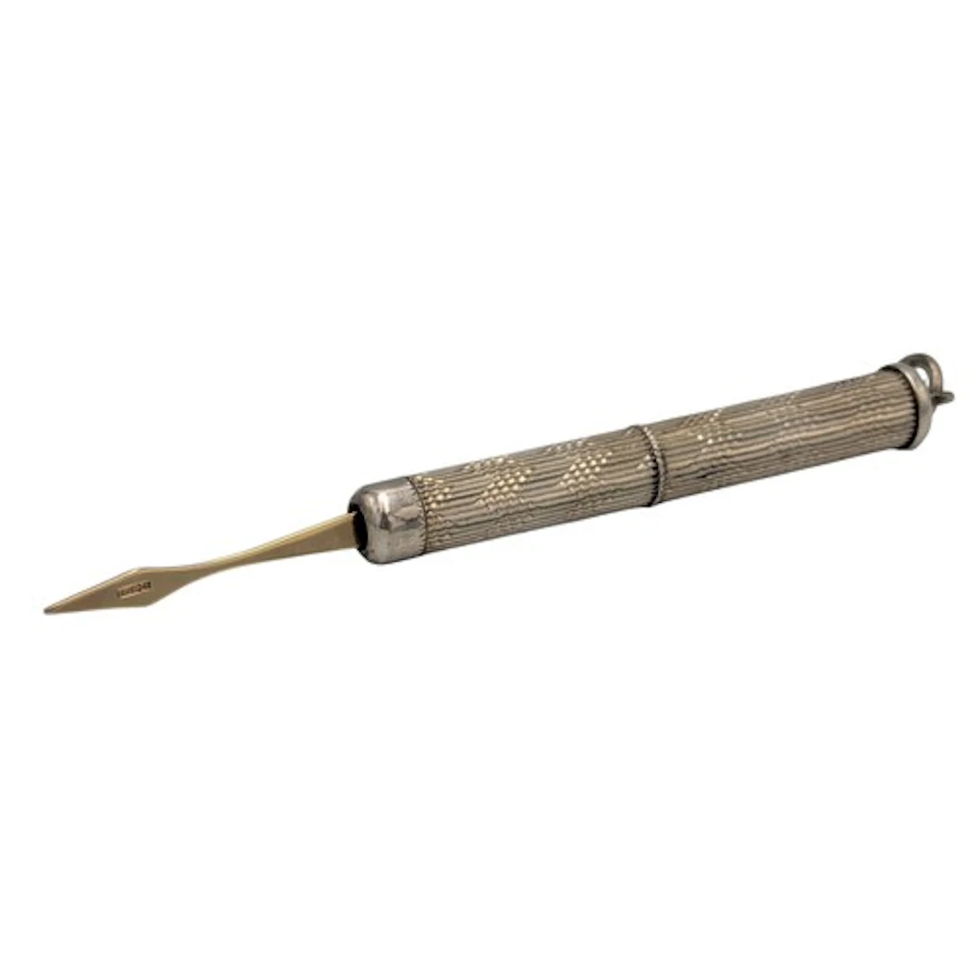 A 9ct gold and silver twist action tooth pick, tip stamped 9...