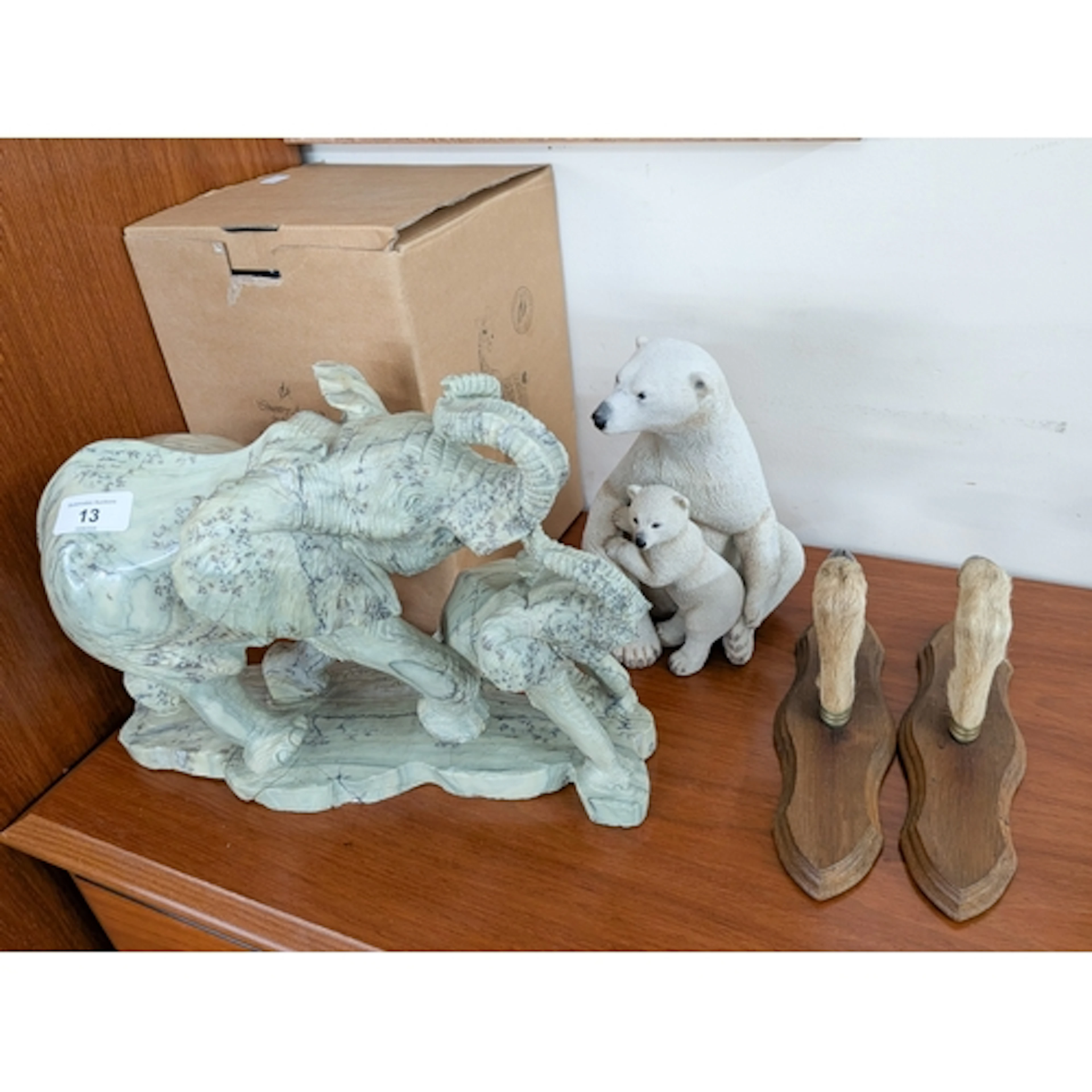 A large carved stone elephant group together with a pair of ...