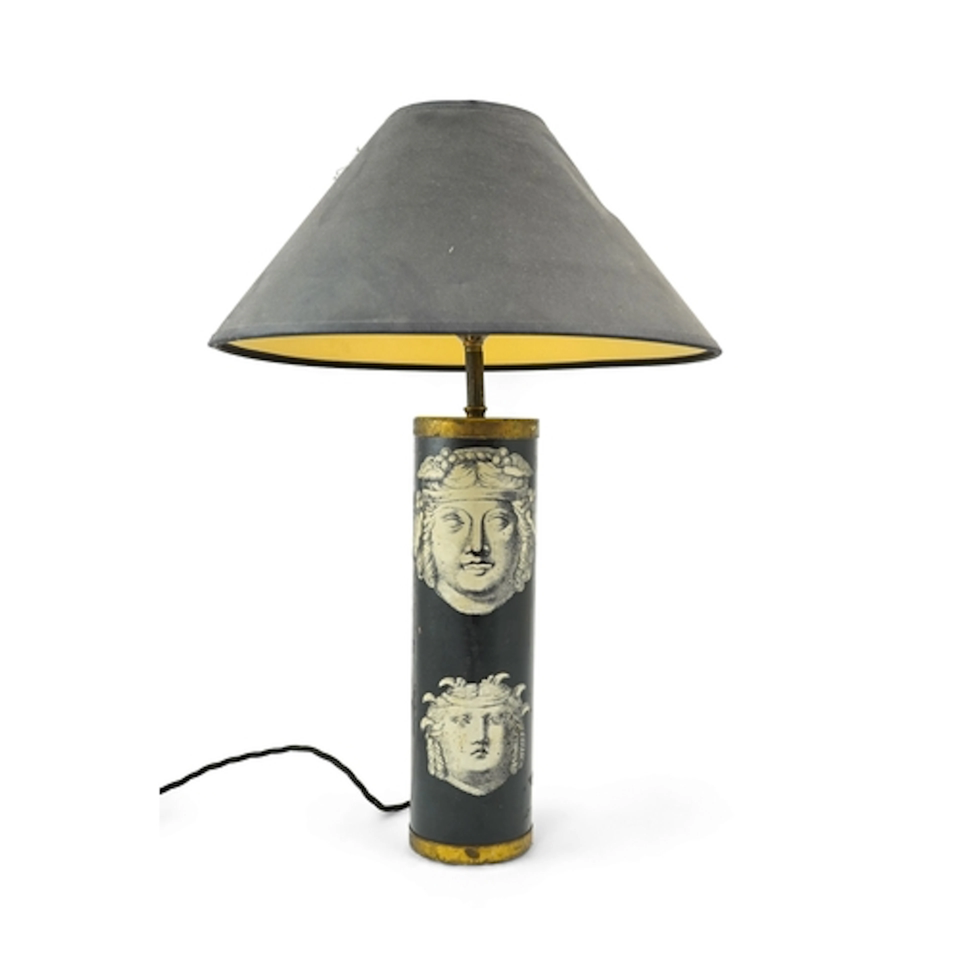 Piero Fornasetti (Italian, 1913-1988): A table lamp, the cyl...