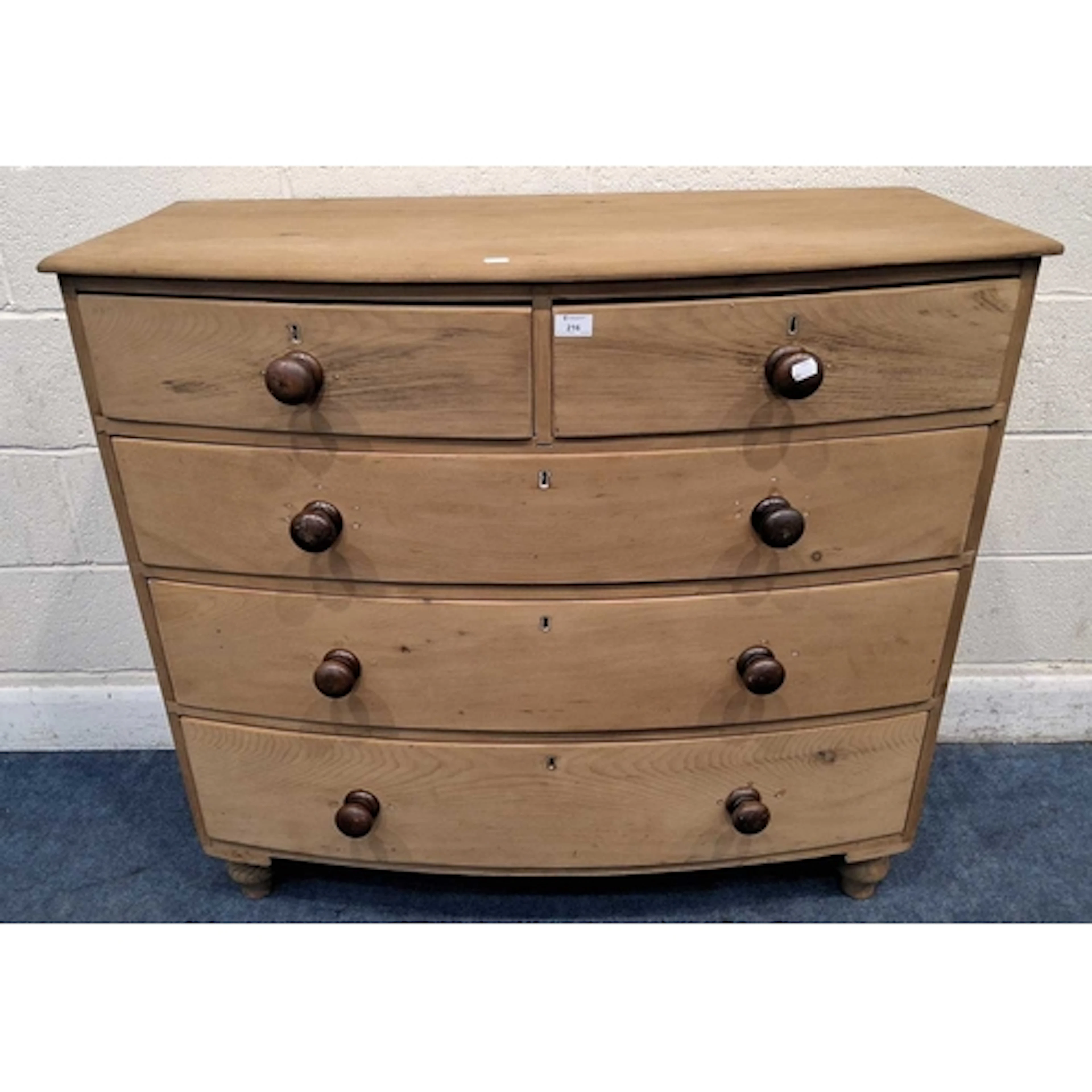 A 19TH CENTURY BOW FRONT PINE CHEST OF TWO SHORT OVER THREE ...