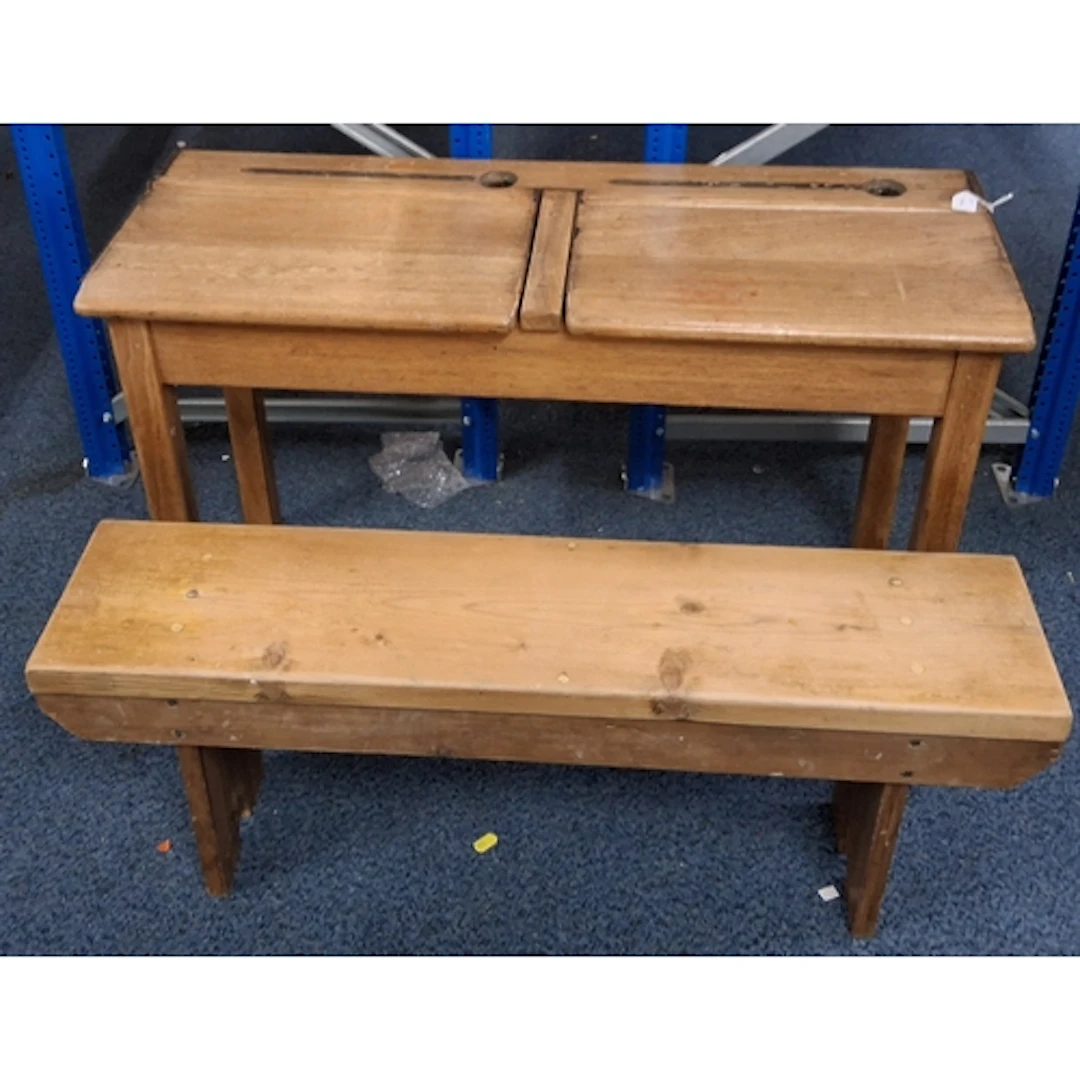 A VINTAGE CHILD'S DOUBLE SCHOOL DESK AND BENCH, featuring tw...