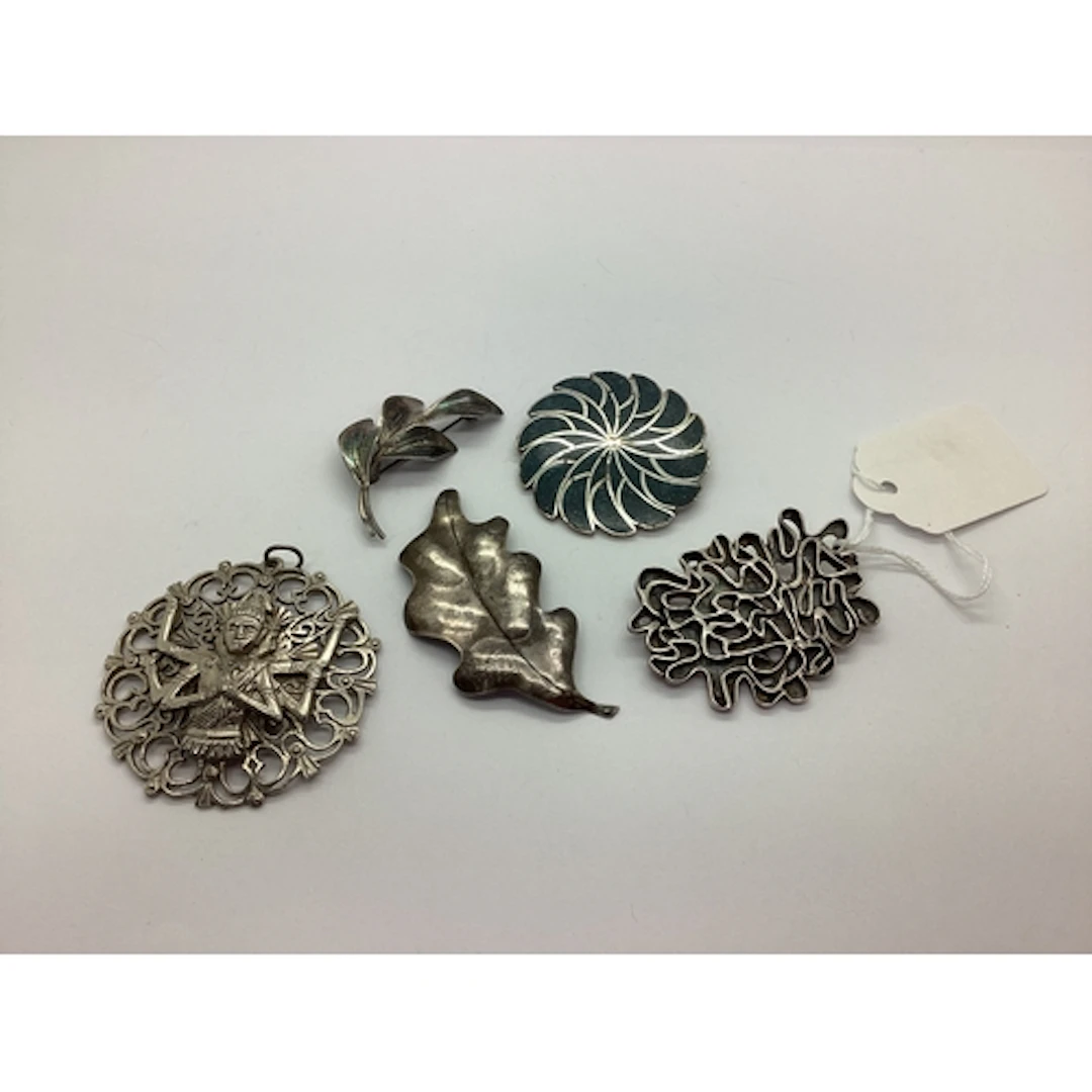 A Brutalist Style Brooch, of openwork design, an oak leaf st...