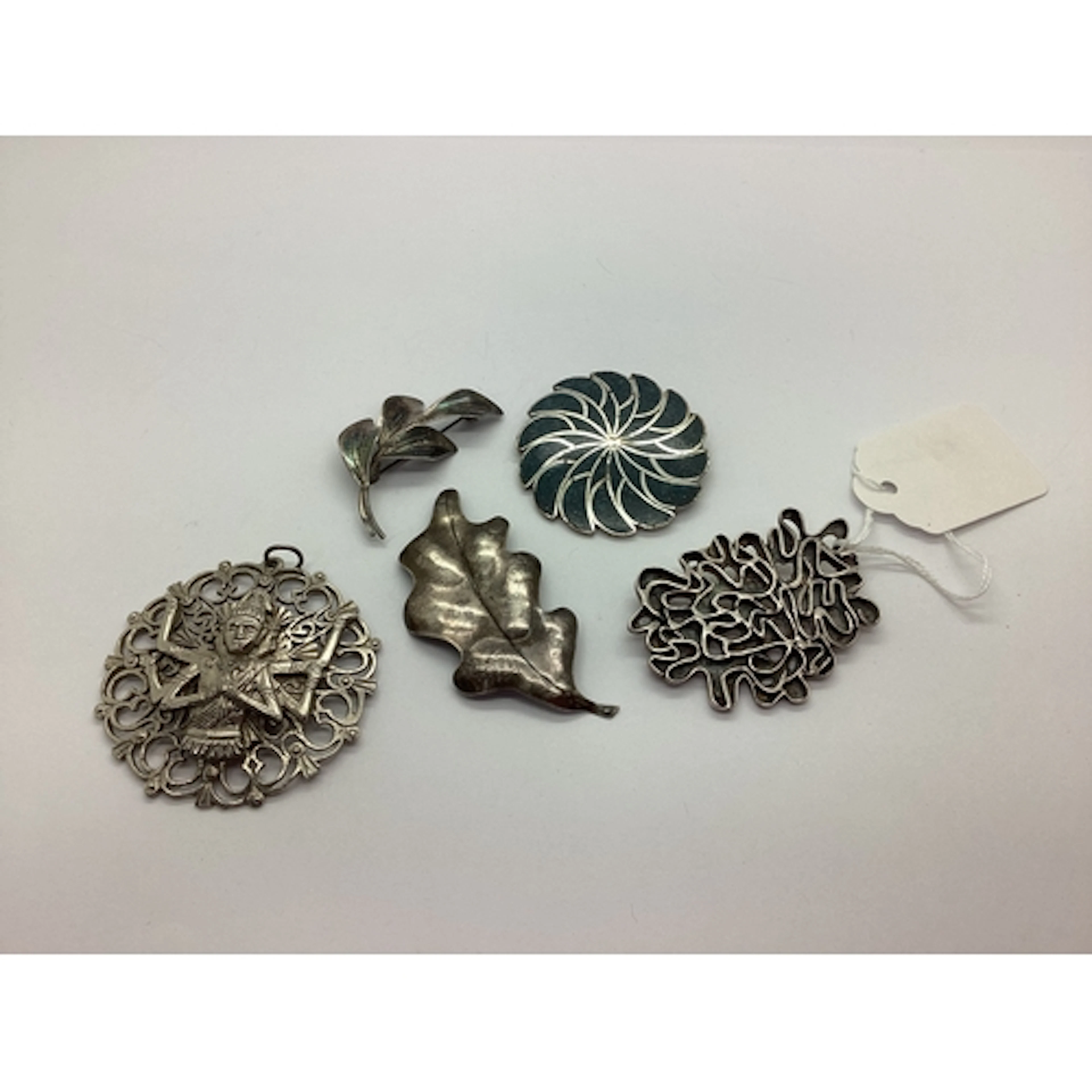 A Brutalist Style Brooch, of openwork design, an oak leaf st...
