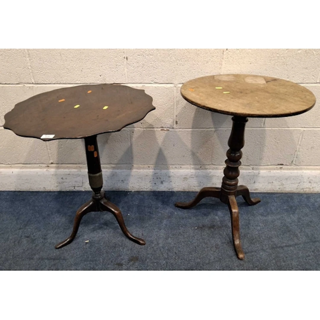 A MAHOGANY TRIPOD TABLE, with a wavy edge, the support with ...
