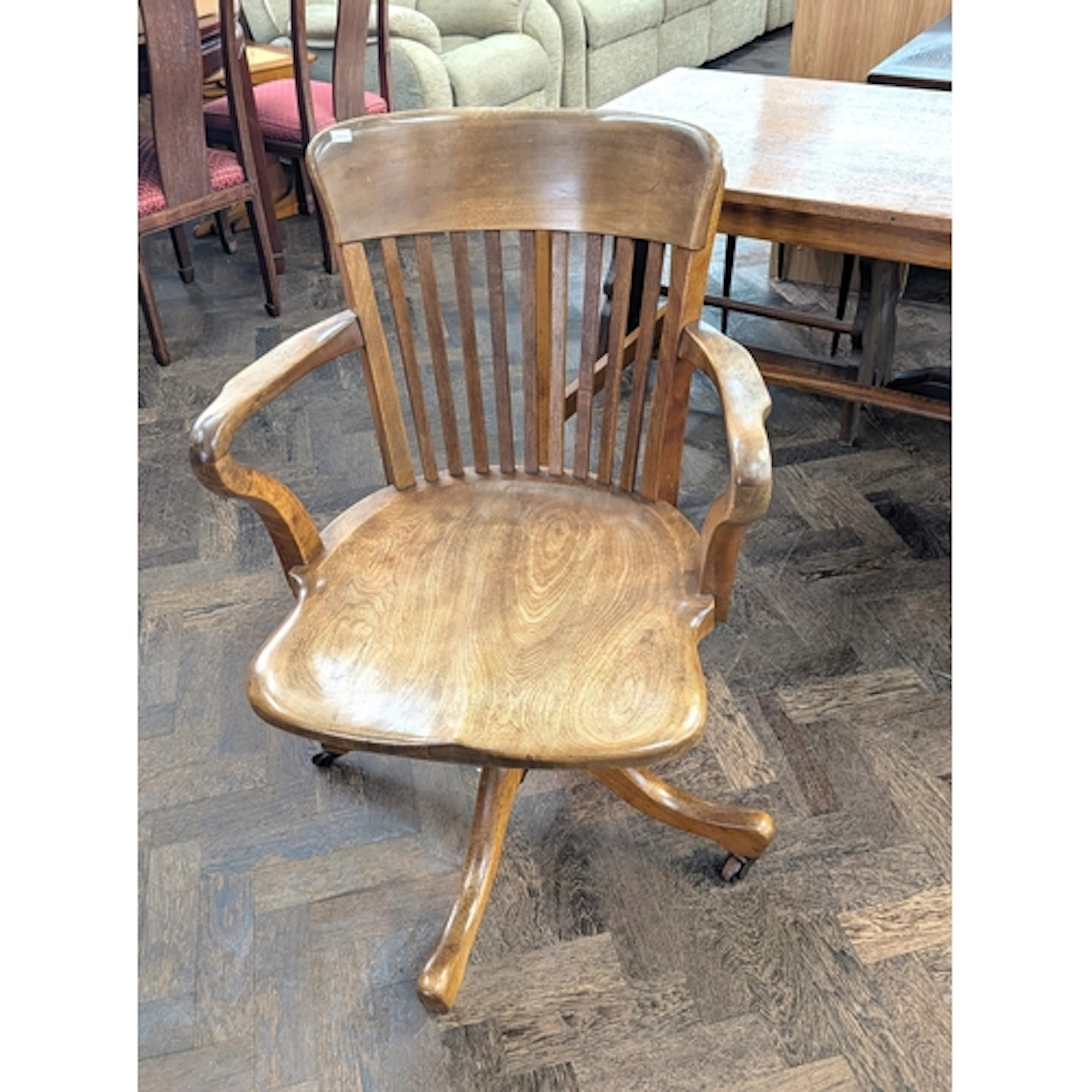 Vintage elm revolving office chair on a sprung base