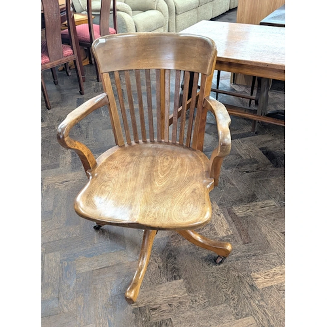 Vintage elm revolving office chair on a sprung base