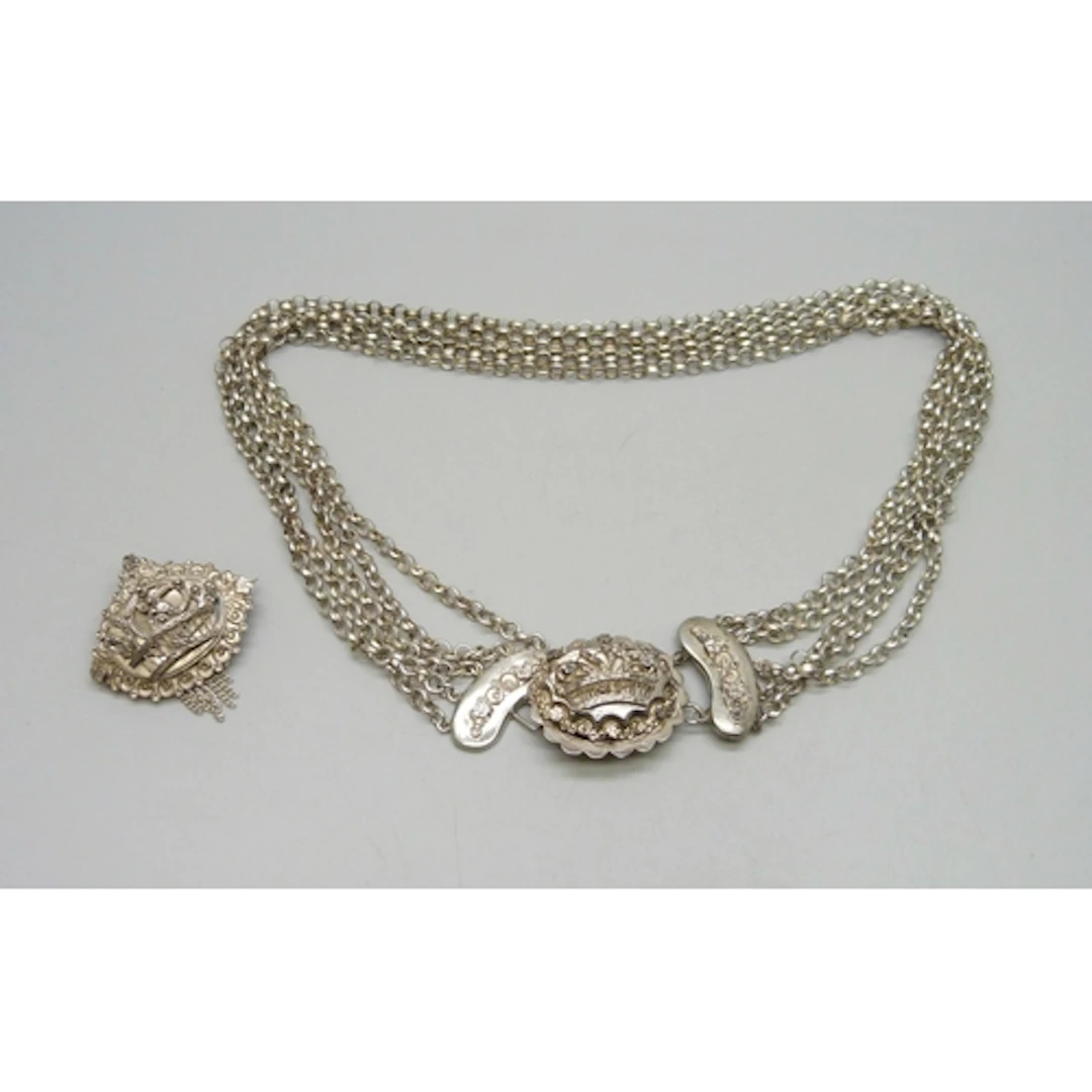 A vintage white metal necklace and a matching brooch, 3.3cm,...