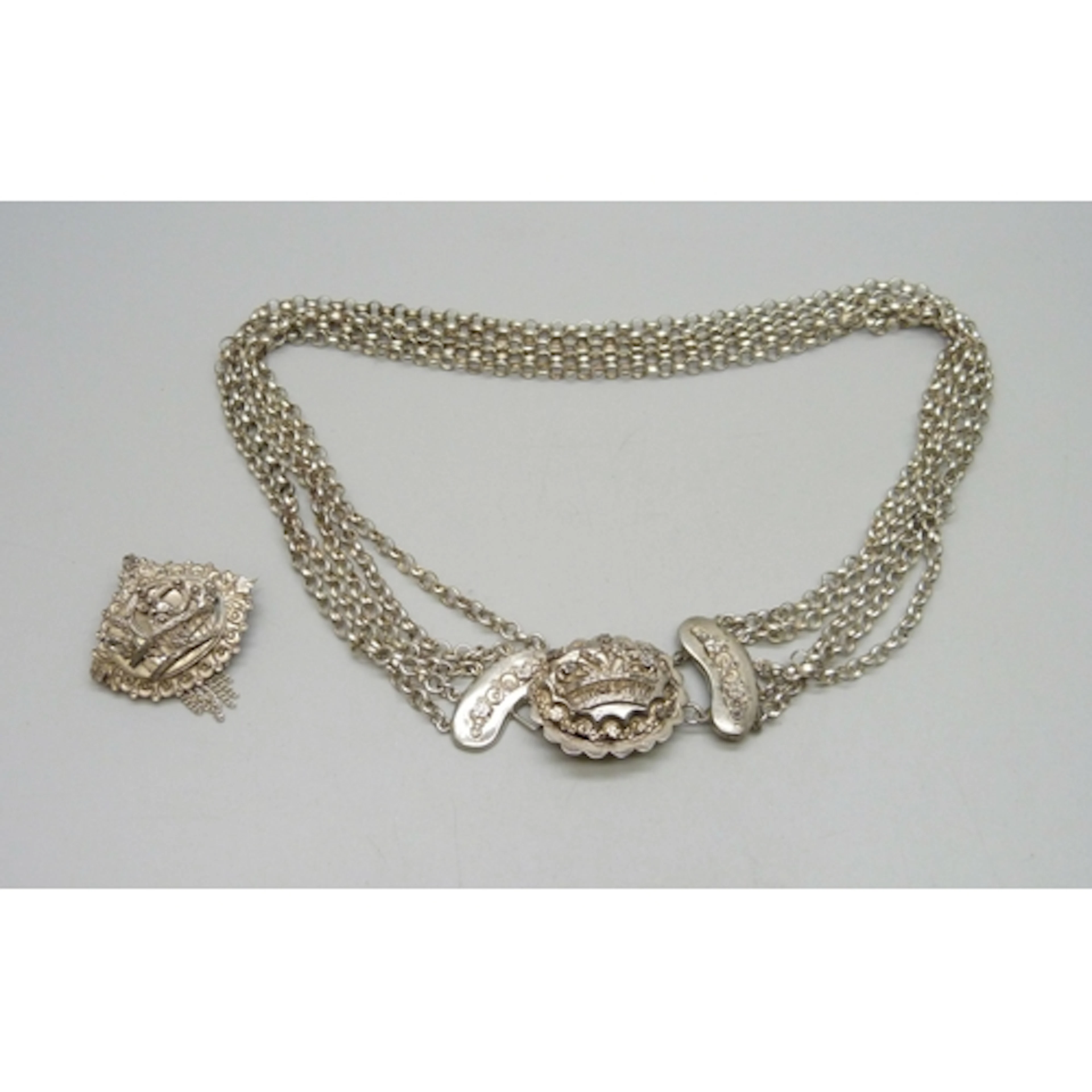 A vintage white metal necklace and a matching brooch, 3.3cm,...