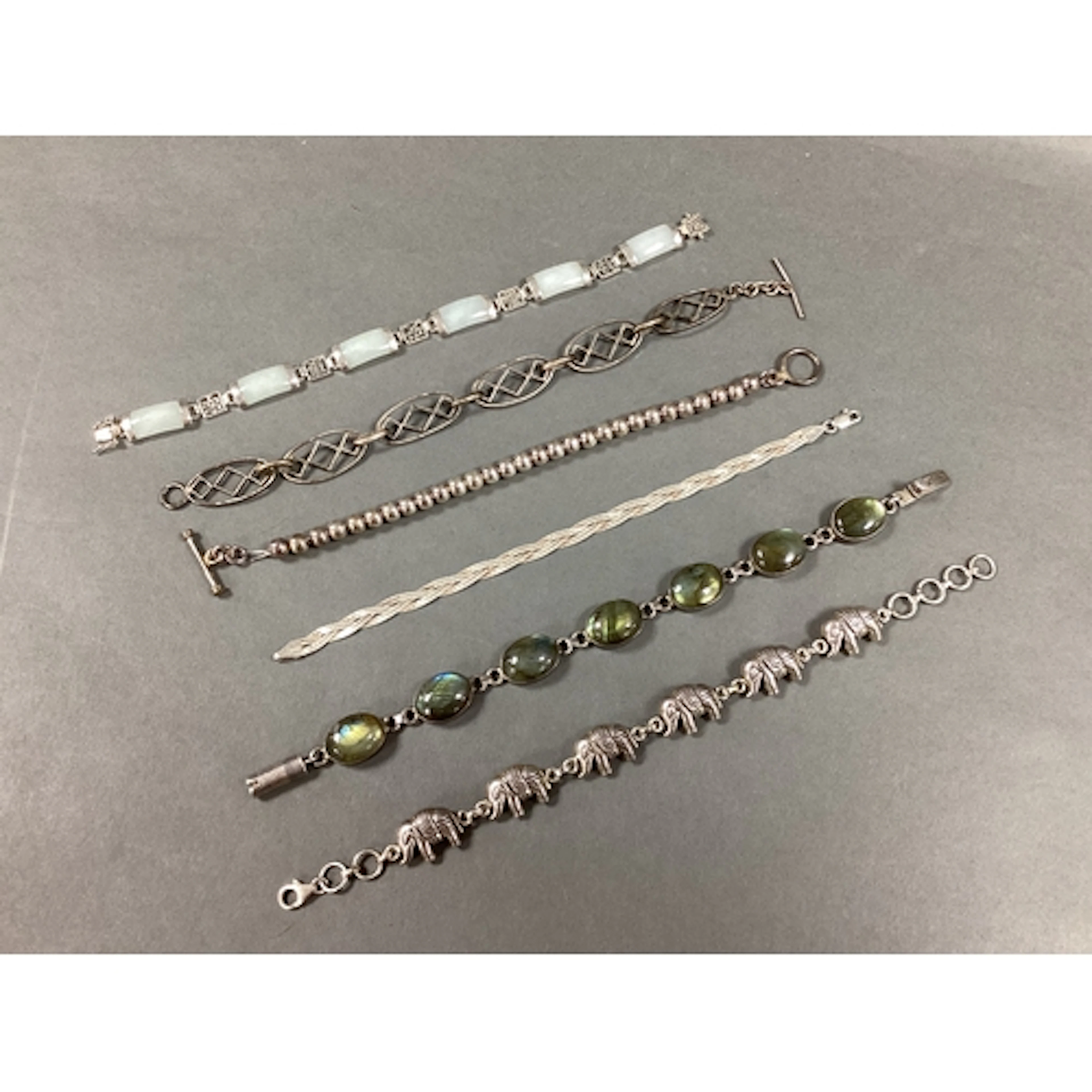 A Collection of Assorted Bracelets, including an oval caboch...